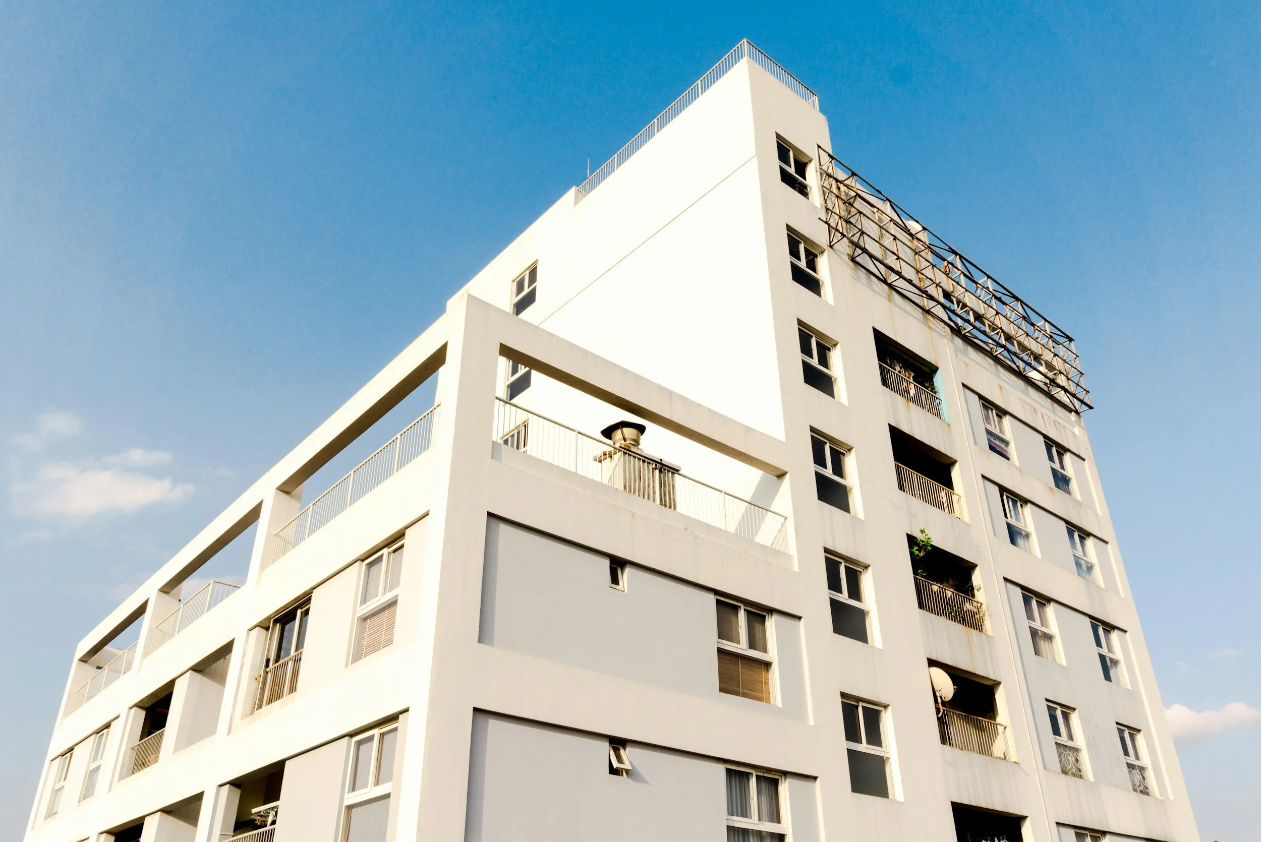 exterior of white condo building