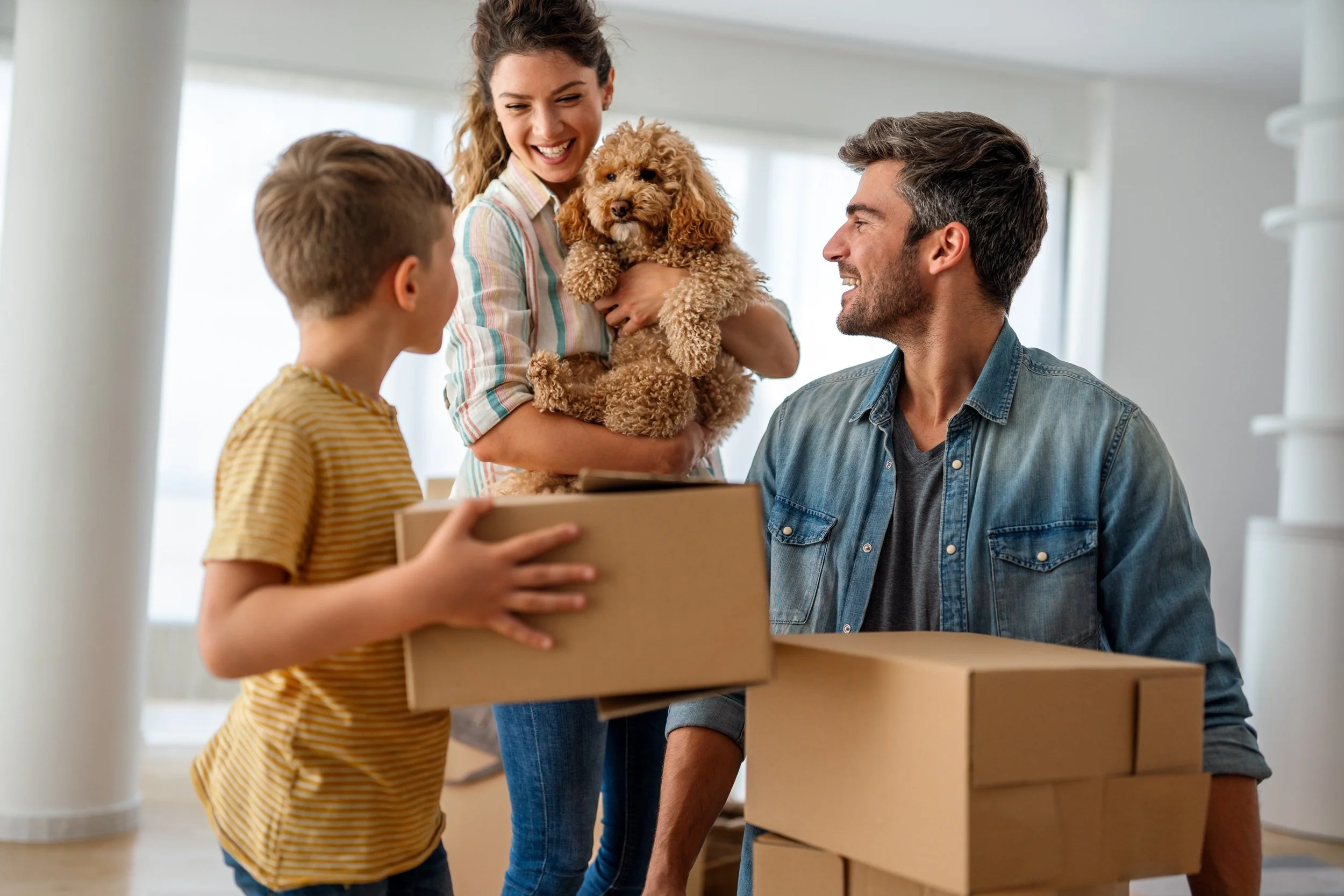 Parents with child moving in new house