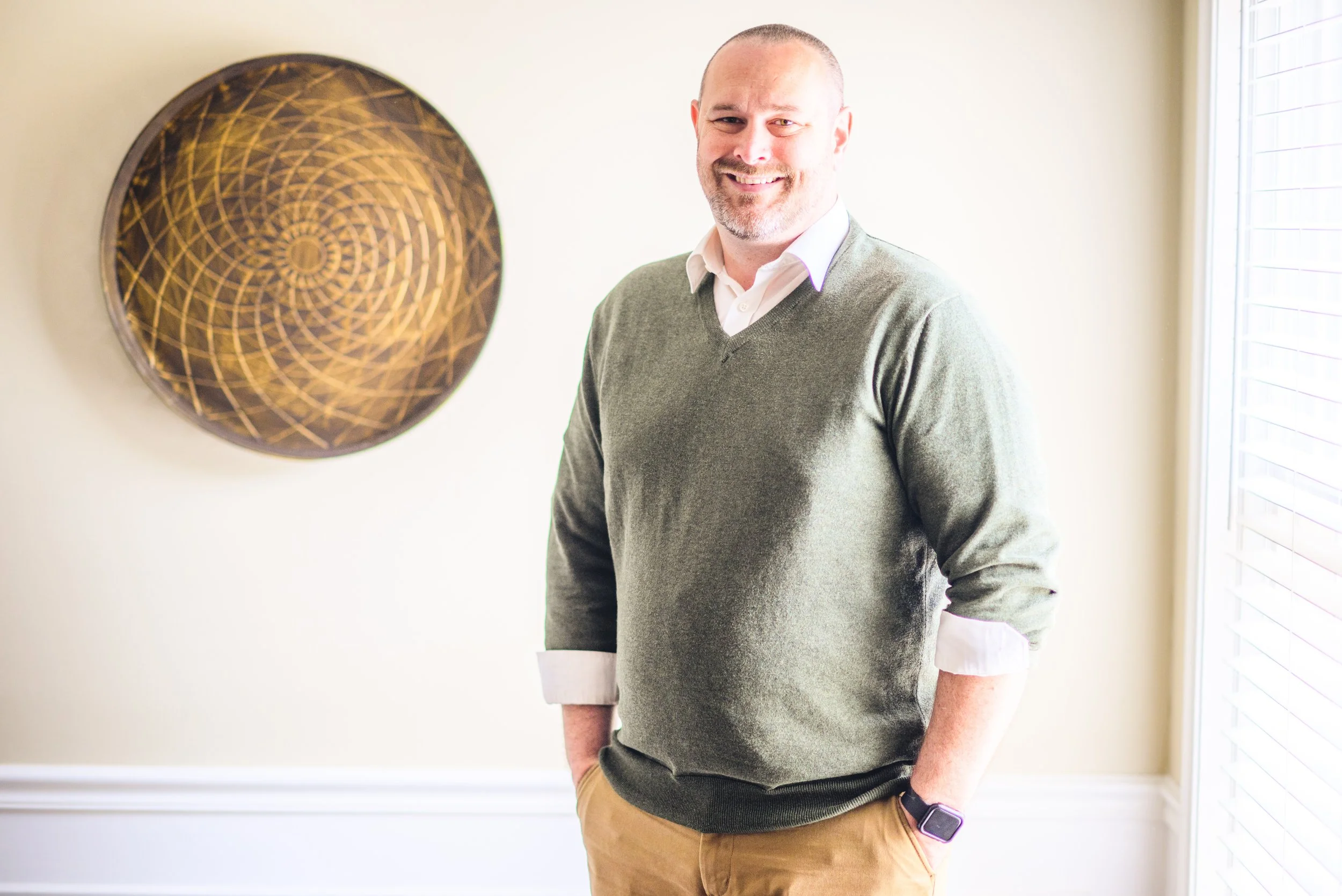 Photograph of Bradford Wolf, Licensed Clinical Social Worker, indoors with a light colored background