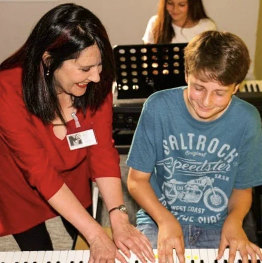 a keyboard lesson taking place at Music Station