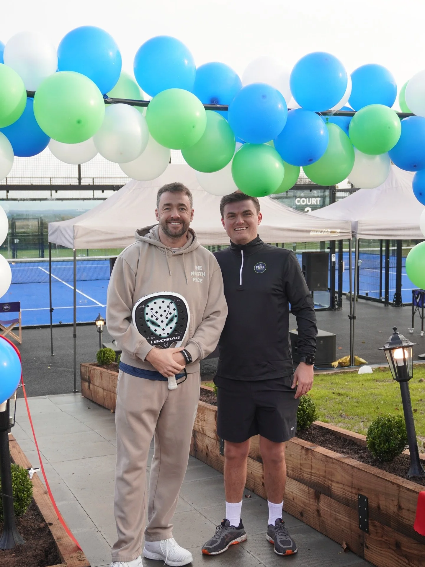 Jason Manford pictured with the club director at the opening event
