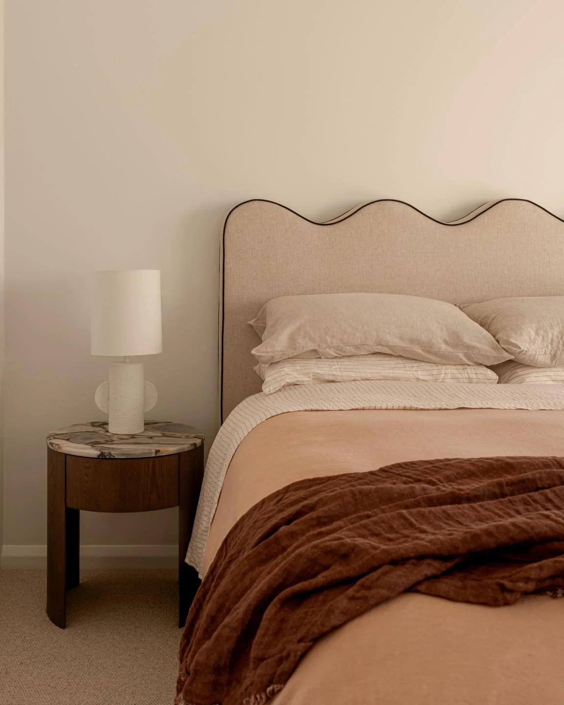 A bedroom should feel like what it is, a place to slow down.

Soft curves and layered neutrals work together to create a space that feels calm, grounded and easy to retreat to at the end of the day. That is exactly what we did in this Elizabeth St be