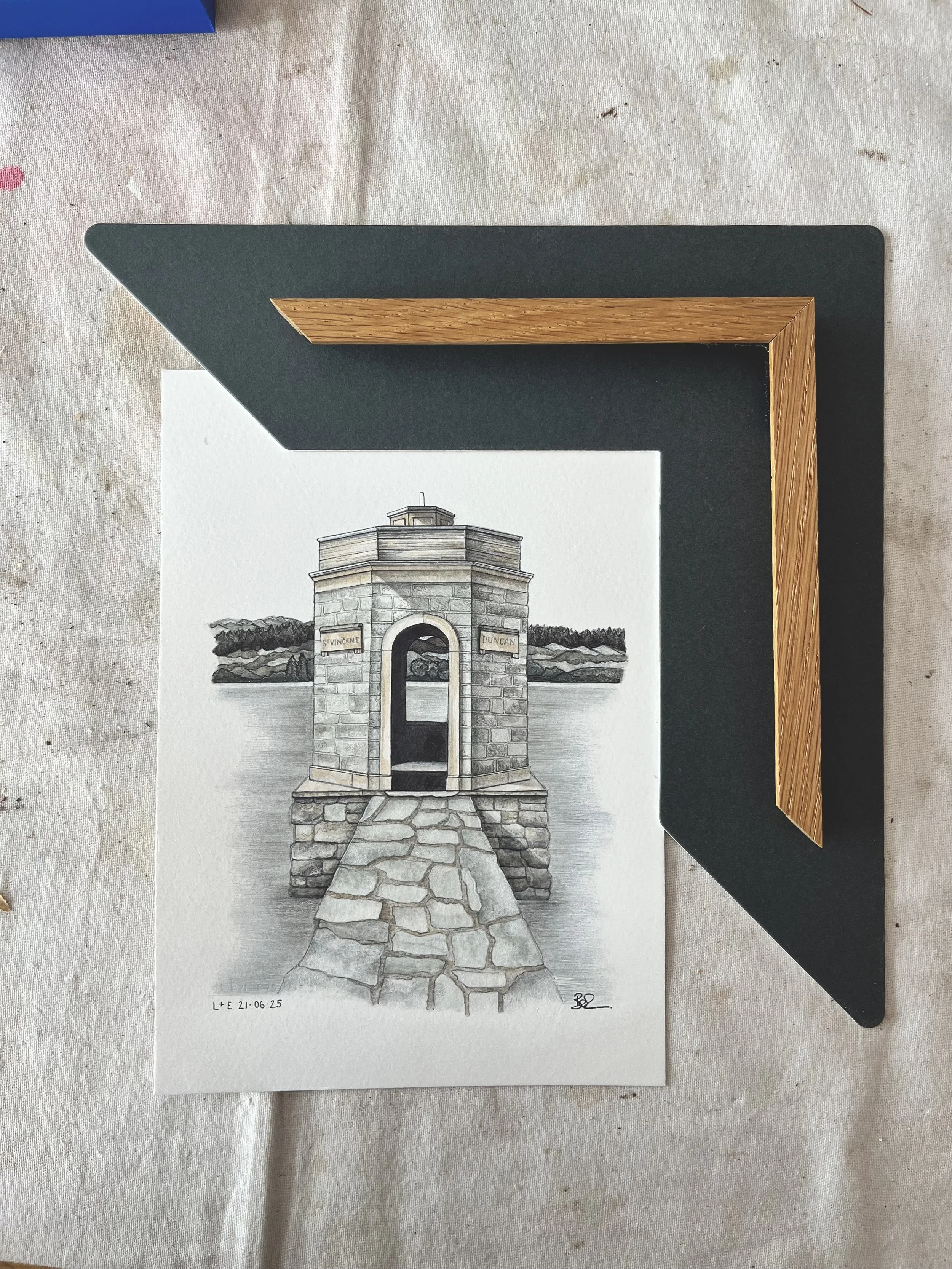 A detailed sketch of a stone monument with an arched opening, situated near water, with trees in the background.