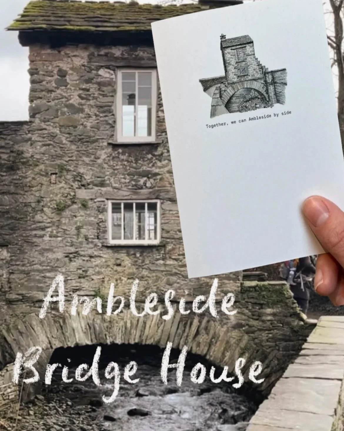 A stone bridge in front of an old stone building with two windows, and a hand holding a paper with a sketch of a stone building and the text "Together, we can Ambleside by side." The words "Ambleside Bridge House" are written over the bridge.