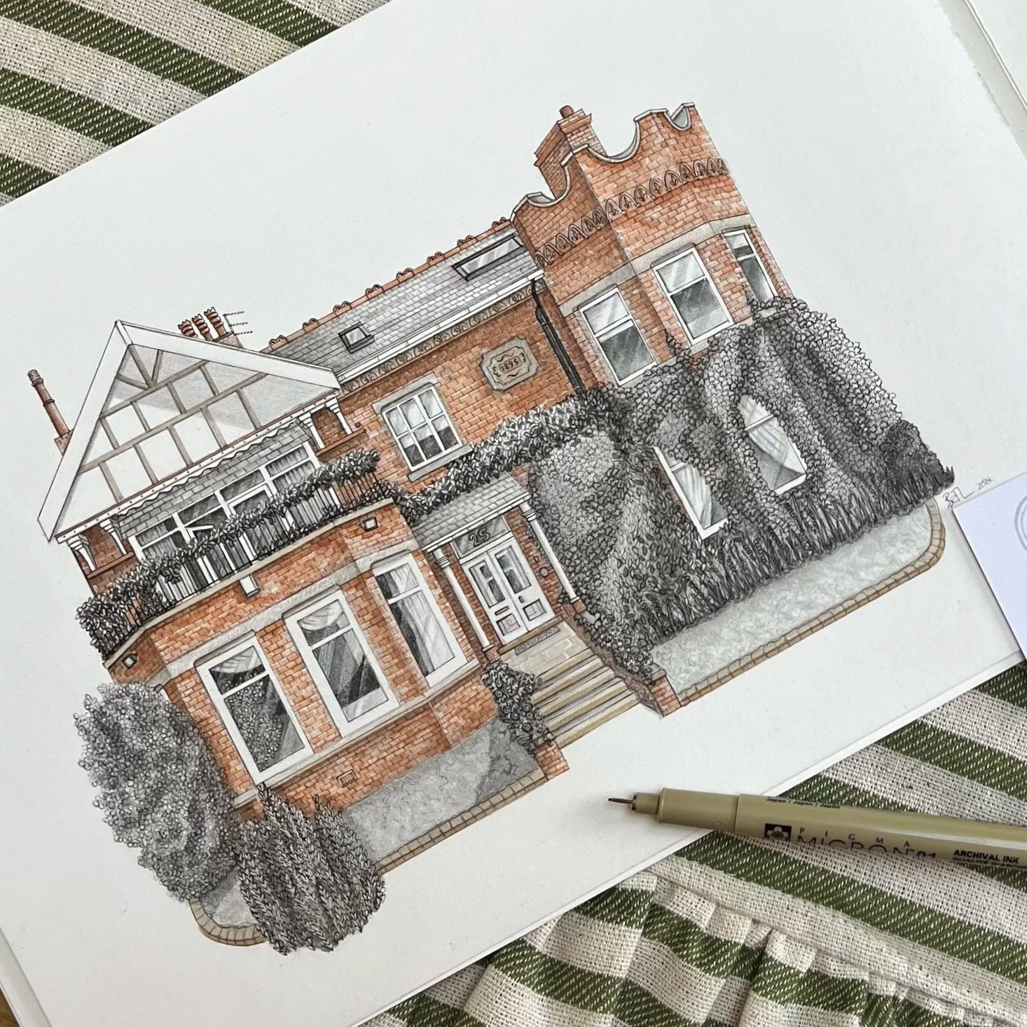 Colorful drawing of a large, Victorian-style brick house with a garden and trees in front.