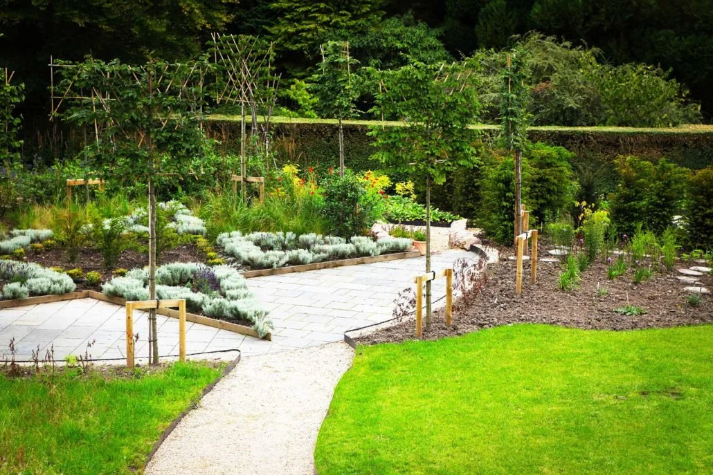 A wider-angled view of the star in the Marian Garden, Kilcoy Castle, showing some lawns and freshly planted beds.