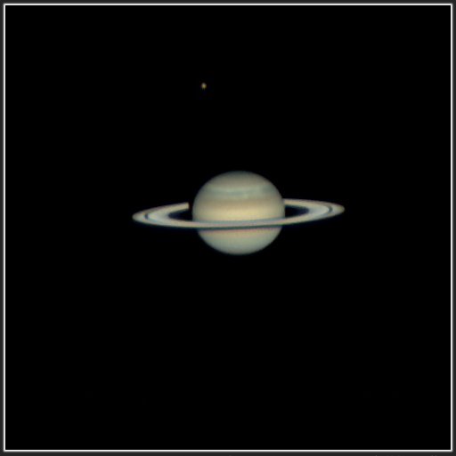 Image of the planet Saturn with its rings, set against the blackness of space.