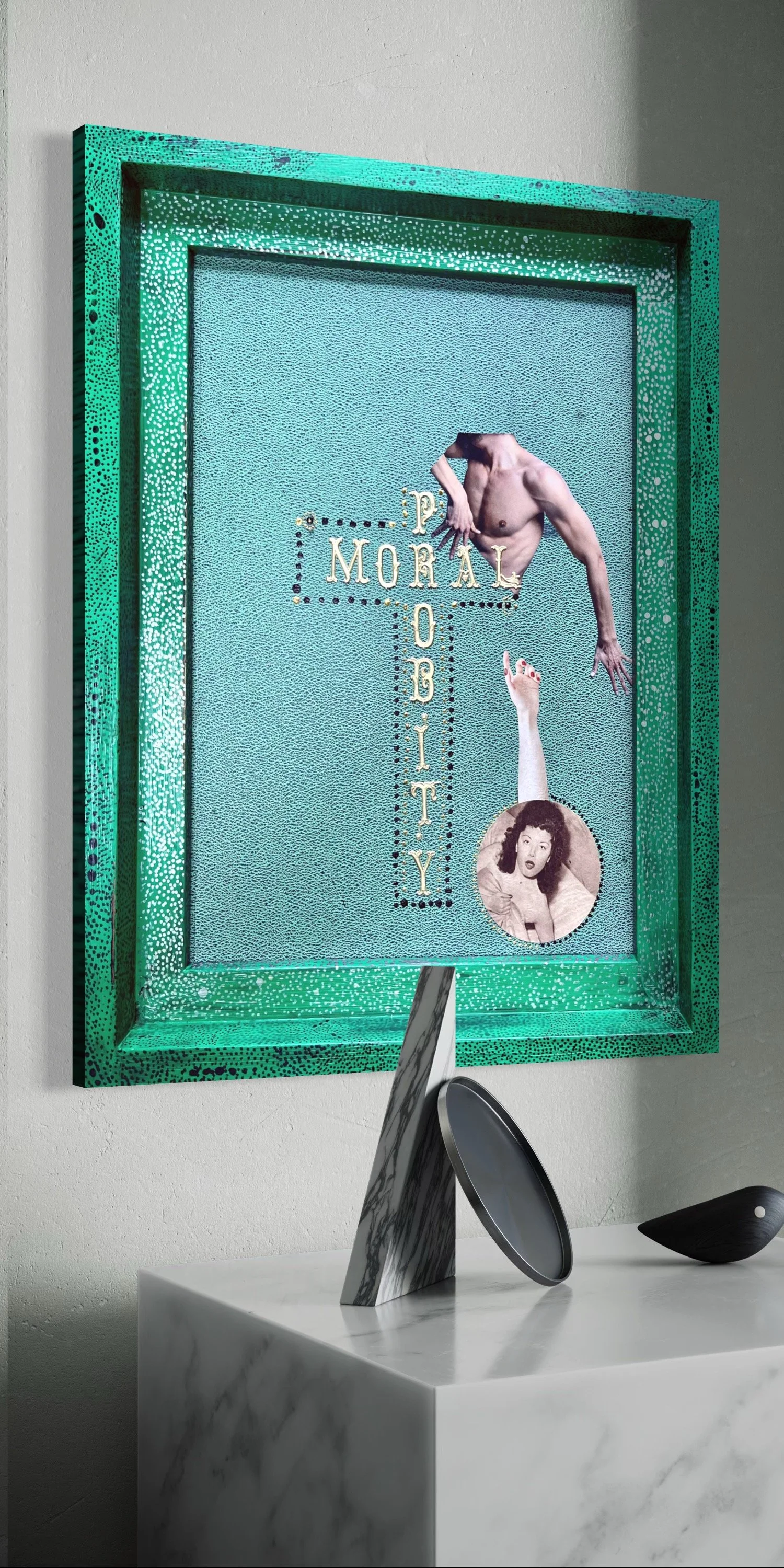Mixed media artwork featuring the words 'Morall Probity' in the centre, with a male torso with one arm extended and a woman pointing upward inside a textured, multicolored framed panel, placed on a marble table with decorative objects.