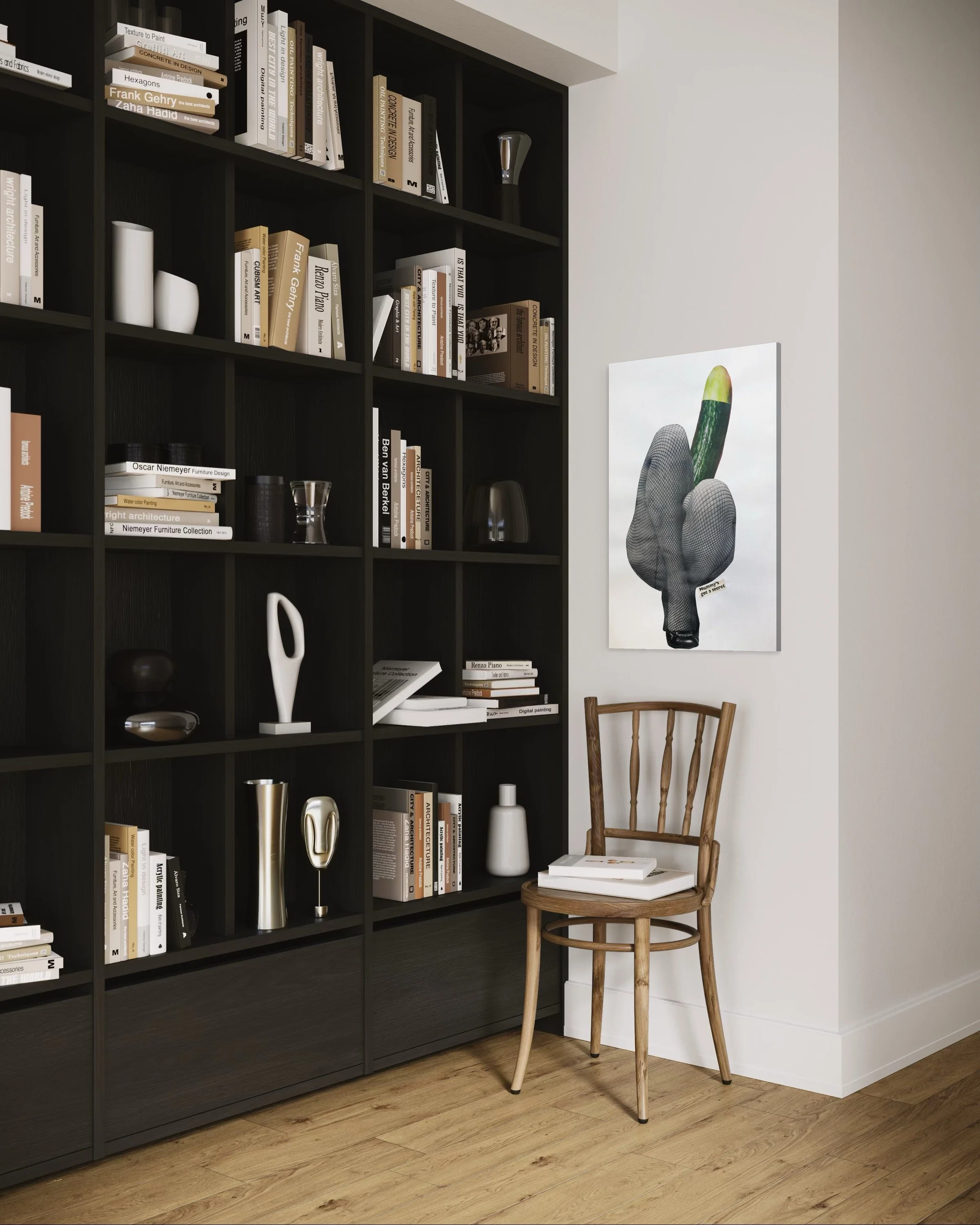 A tall black bookshelf filled with books, decorative objects, and art pieces, positioned next to a light-colored wall. A wooden chair with a curved backrest sits in front of the wall, with a stack of books on it. A large piece of modern art depicting