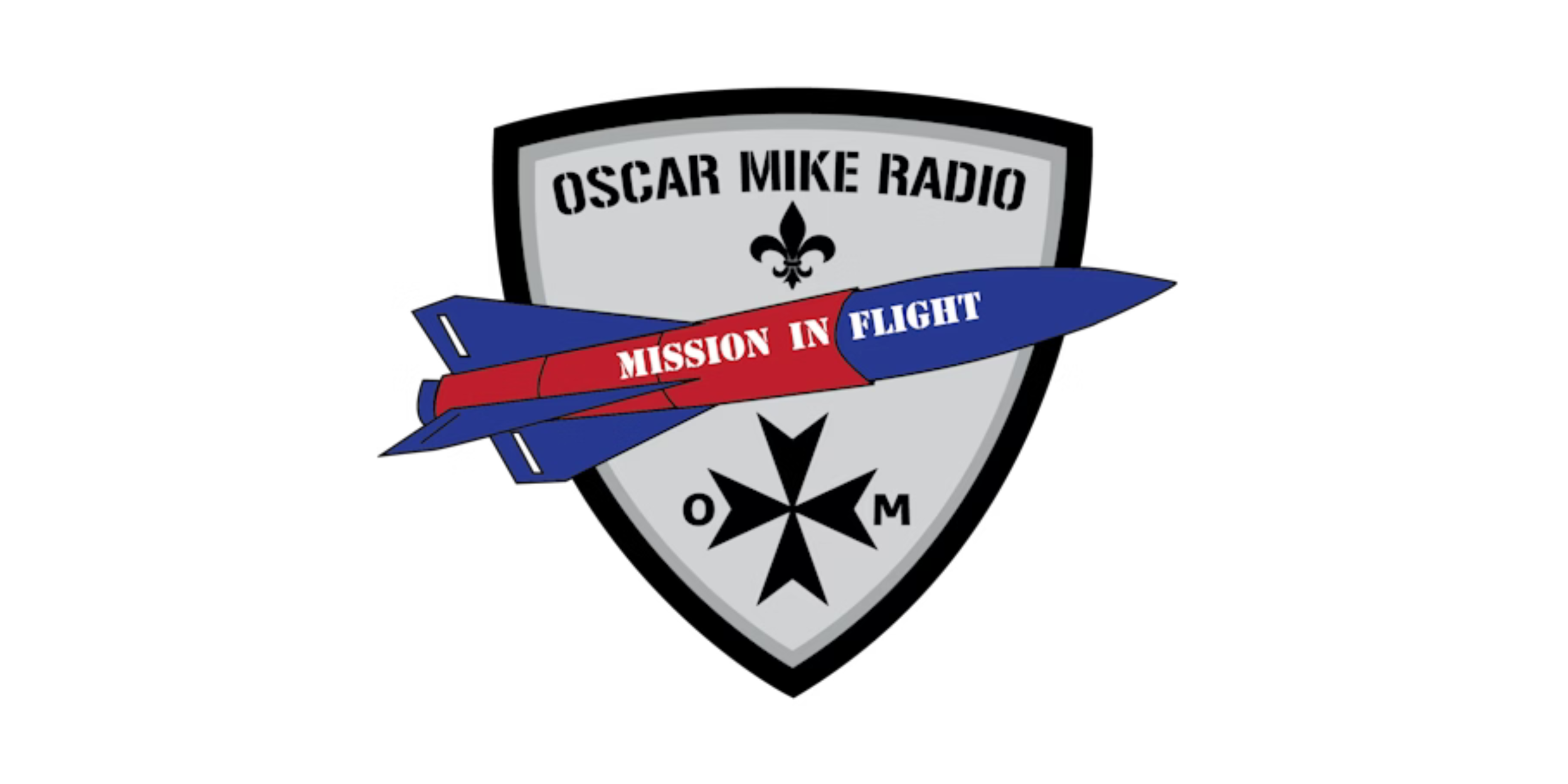 A shield-like emblem featuring a rocket with the words "Mission in Flight" on it, the logo of Oscar Mike Radio, and military symbols.