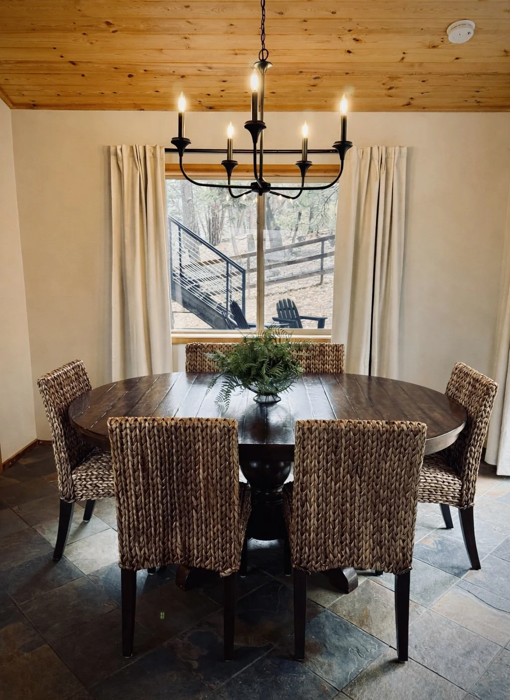 The Estate House dining room is a warm and inviting space, perfect for gathering and shared meals.