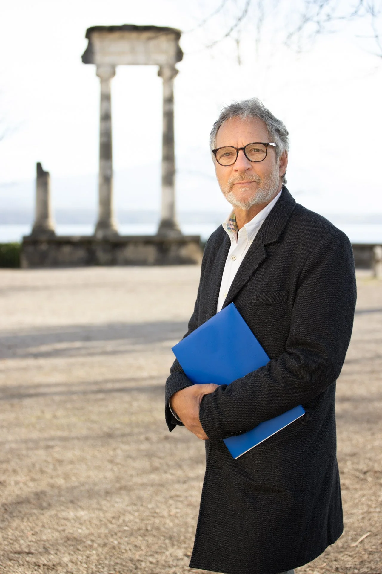 image of a politician by the roman pillars in nyon catherine lewis photogaphy.jpg