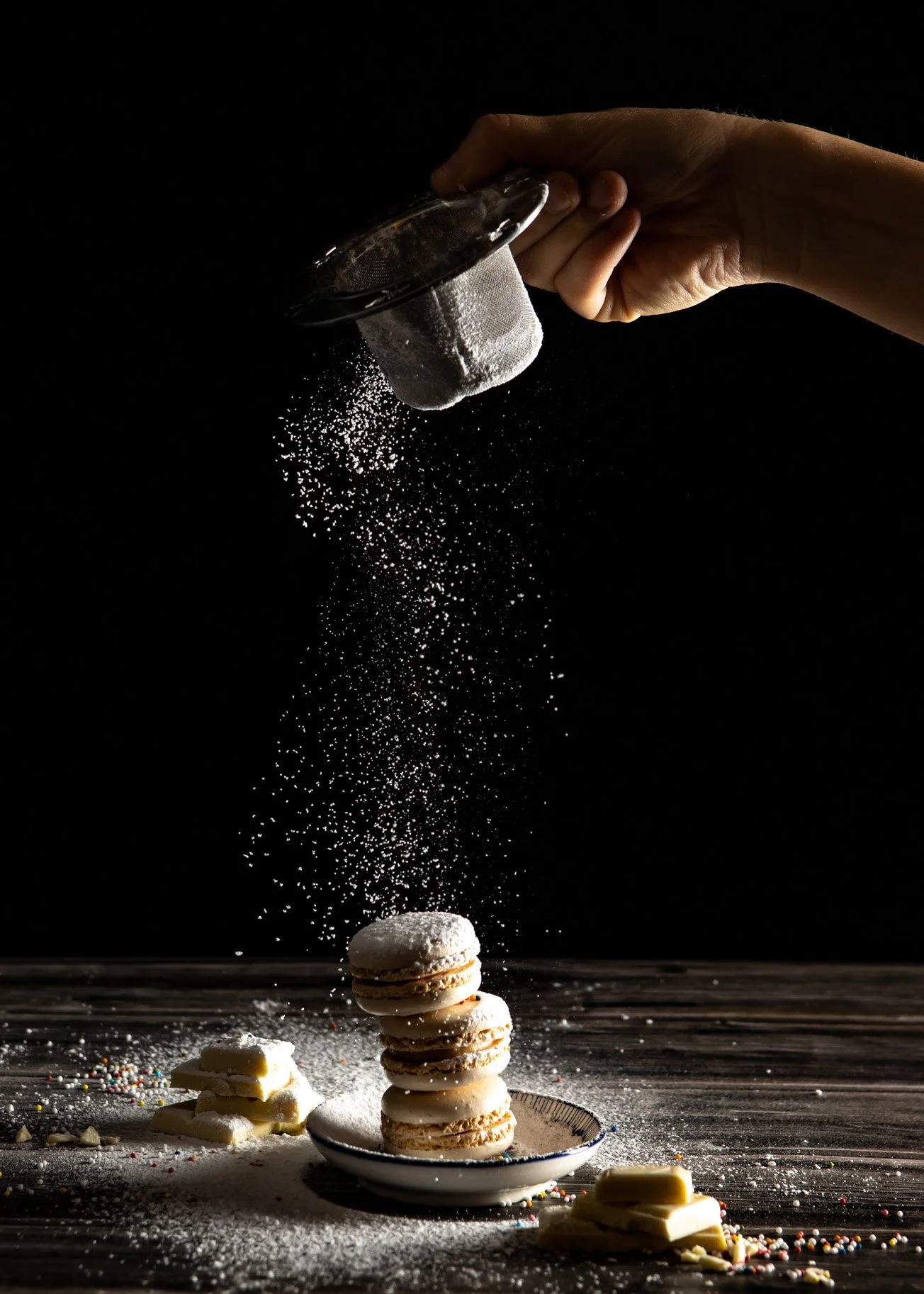 photo of icing sugar sprinkled on three macaroons catherinelewisphotograpy.jpg
