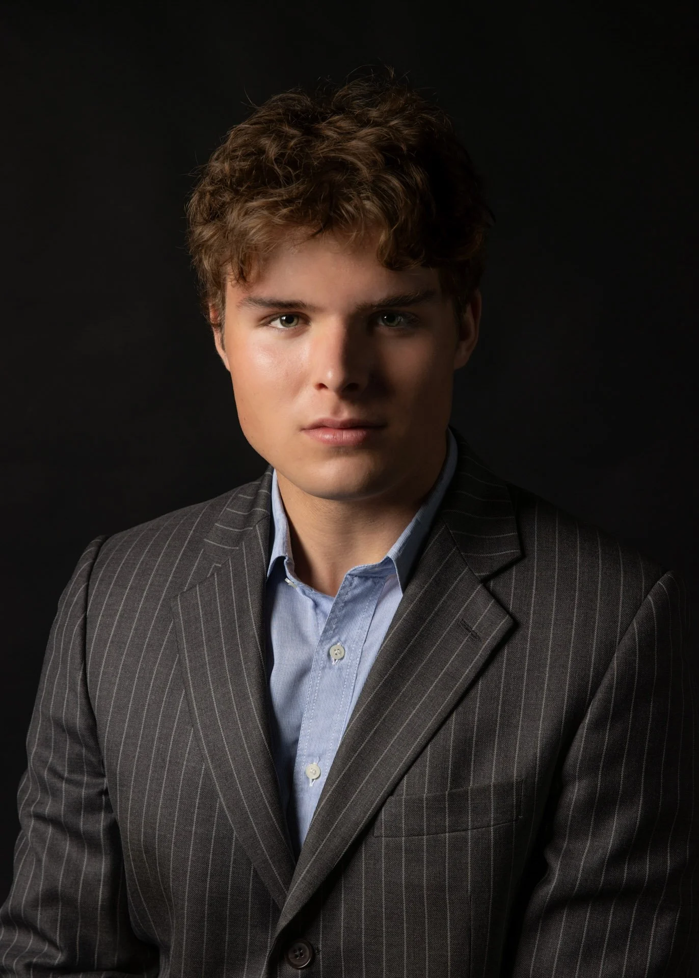 image of a young man in moody lighting catherine lewisphotography.jpg