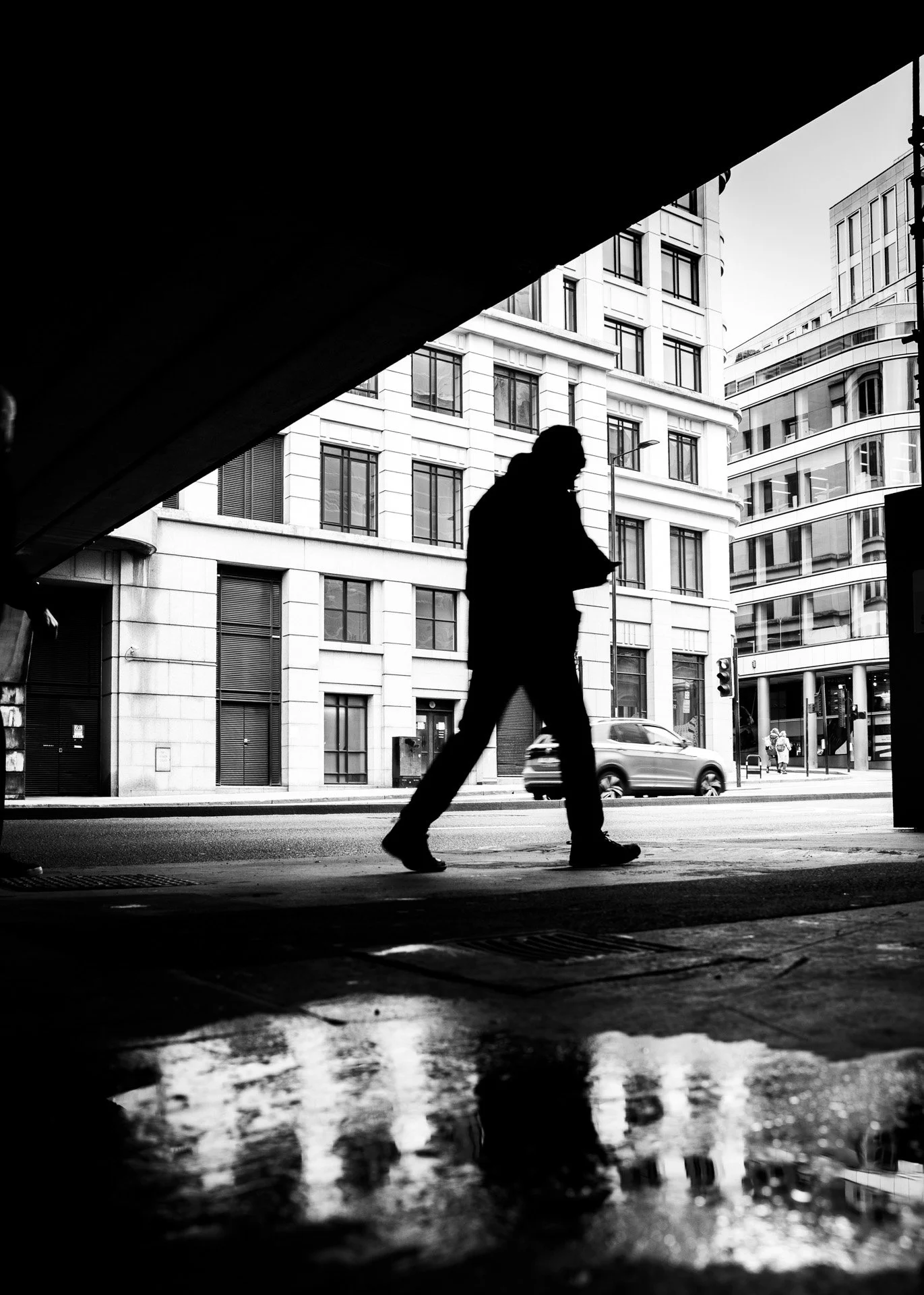 Silhouette of a man walking under Waterloo Bridge  catherinelewisphotography.jpg