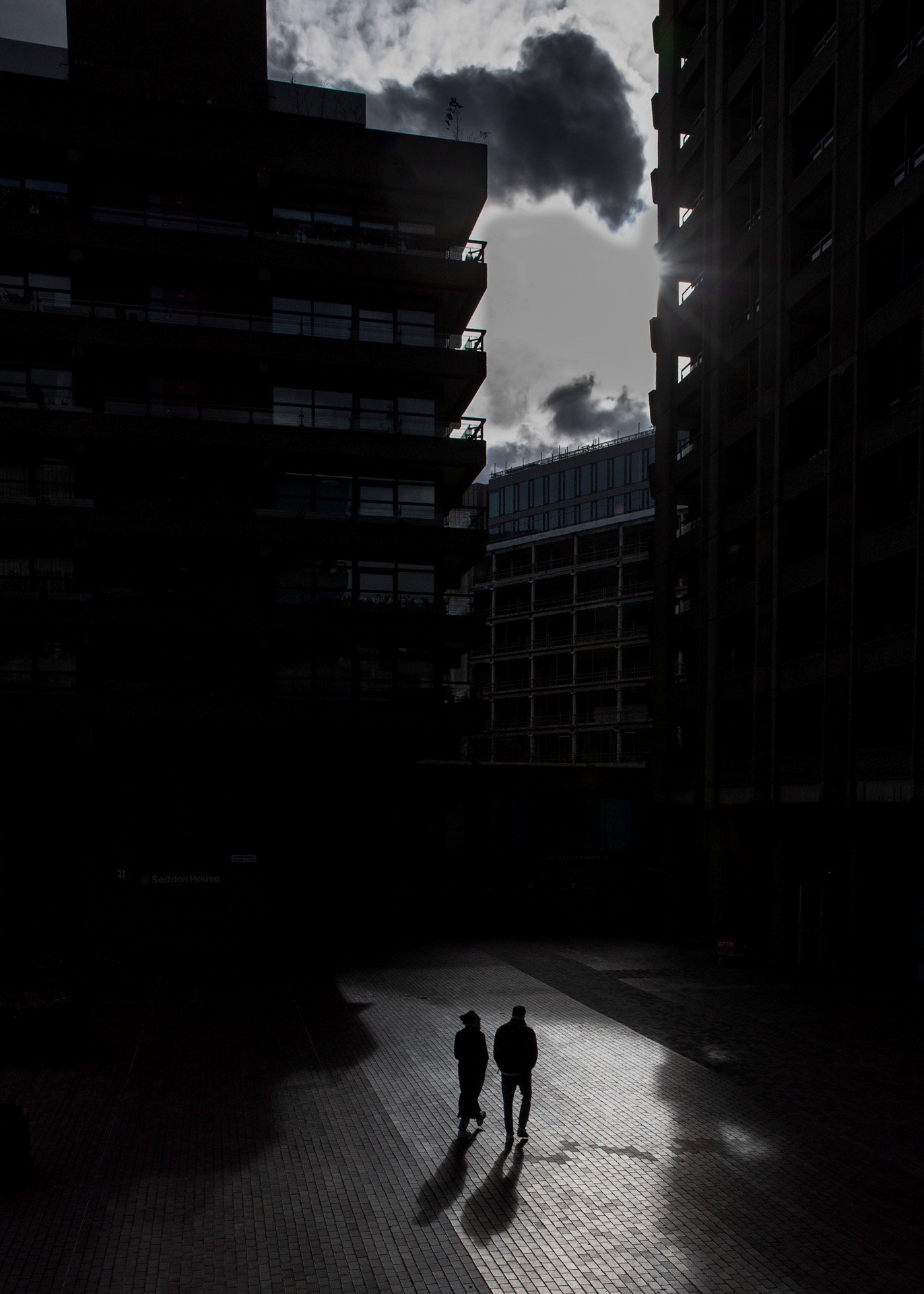 silhouette of a couple walking through the Barbican catherinelewisphotography.jpg
