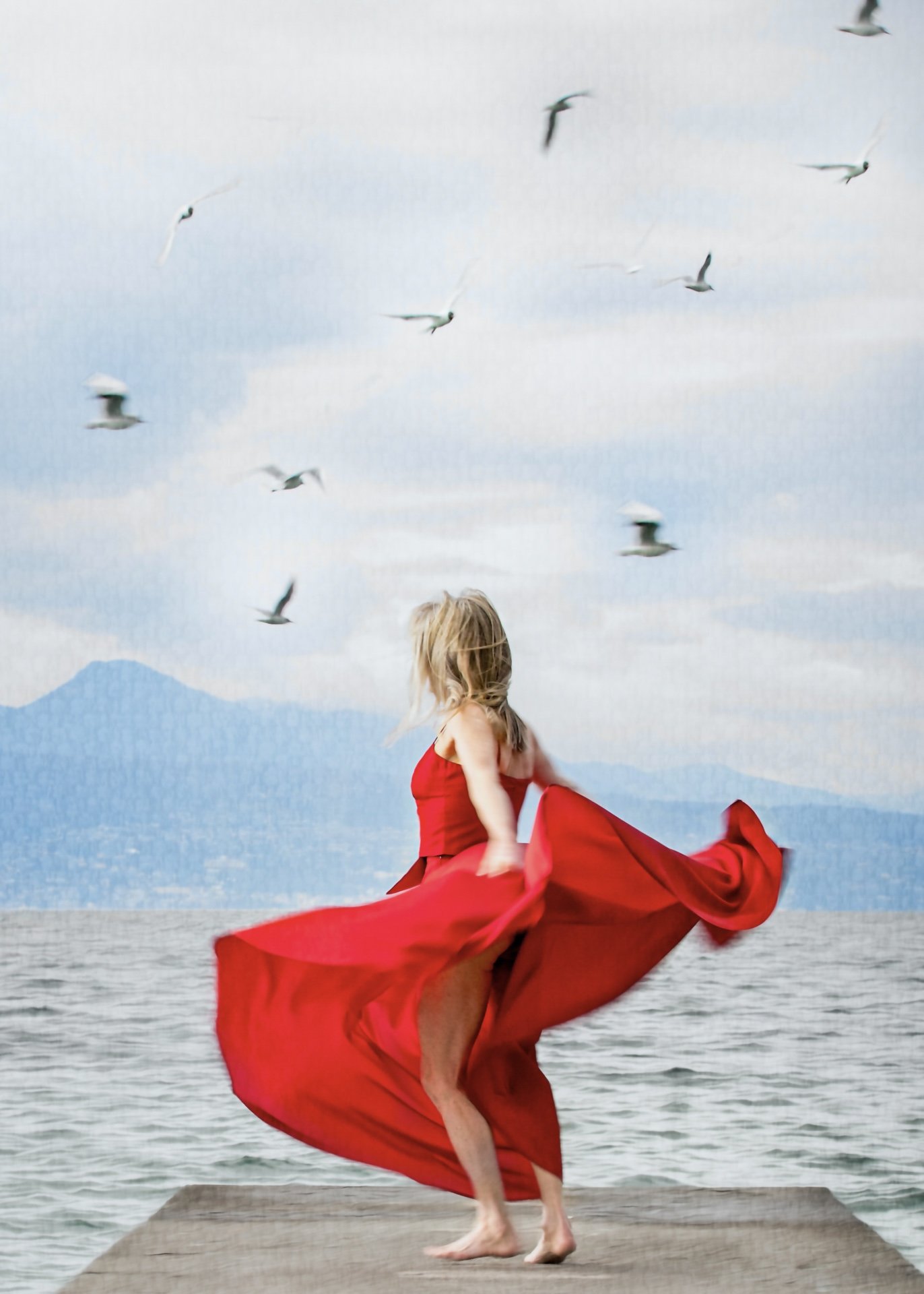 lady swirling with the birds by the lake.jpg