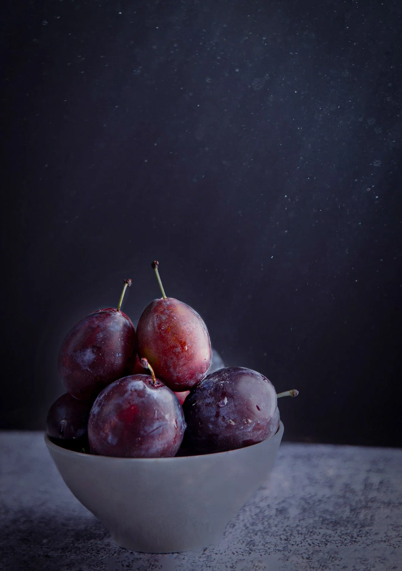 a bowl full of plums photographed to symbolise  sugar plum fairy catherinelewisphotography.jpg