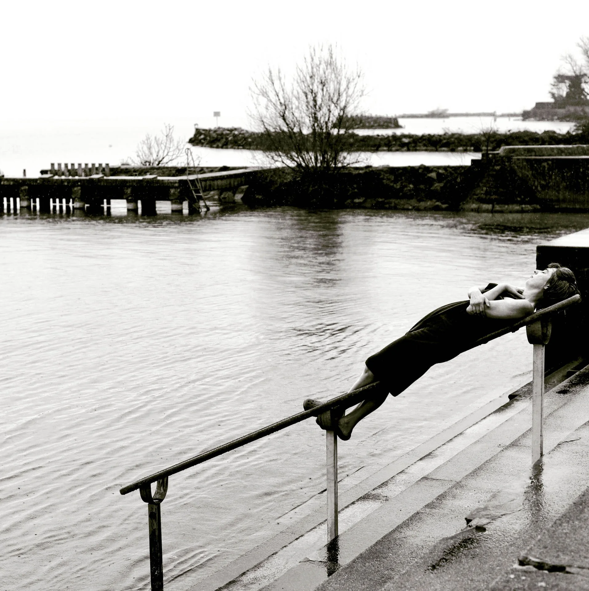 woman resting after swimming in winter in lake geneva catherinelewisphotography.jpg