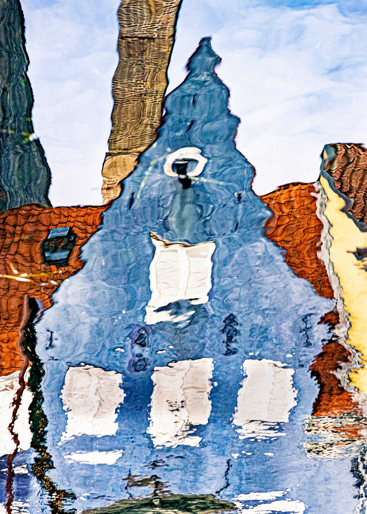 reflection of a blue house in copenhagen catherinelewisphotography.jpg