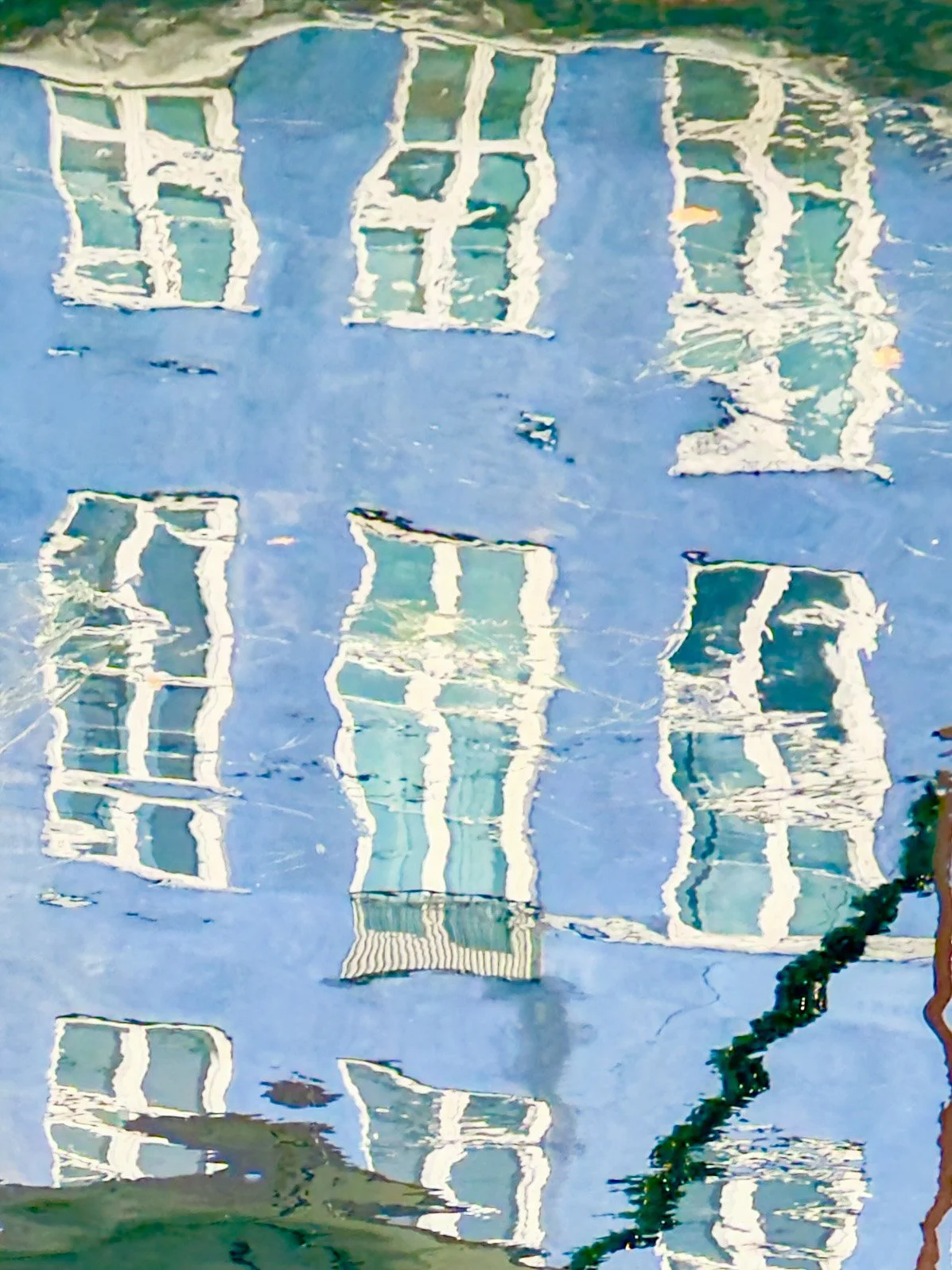 reflection of blue shutters in water  catherinelewisphotography.jpg