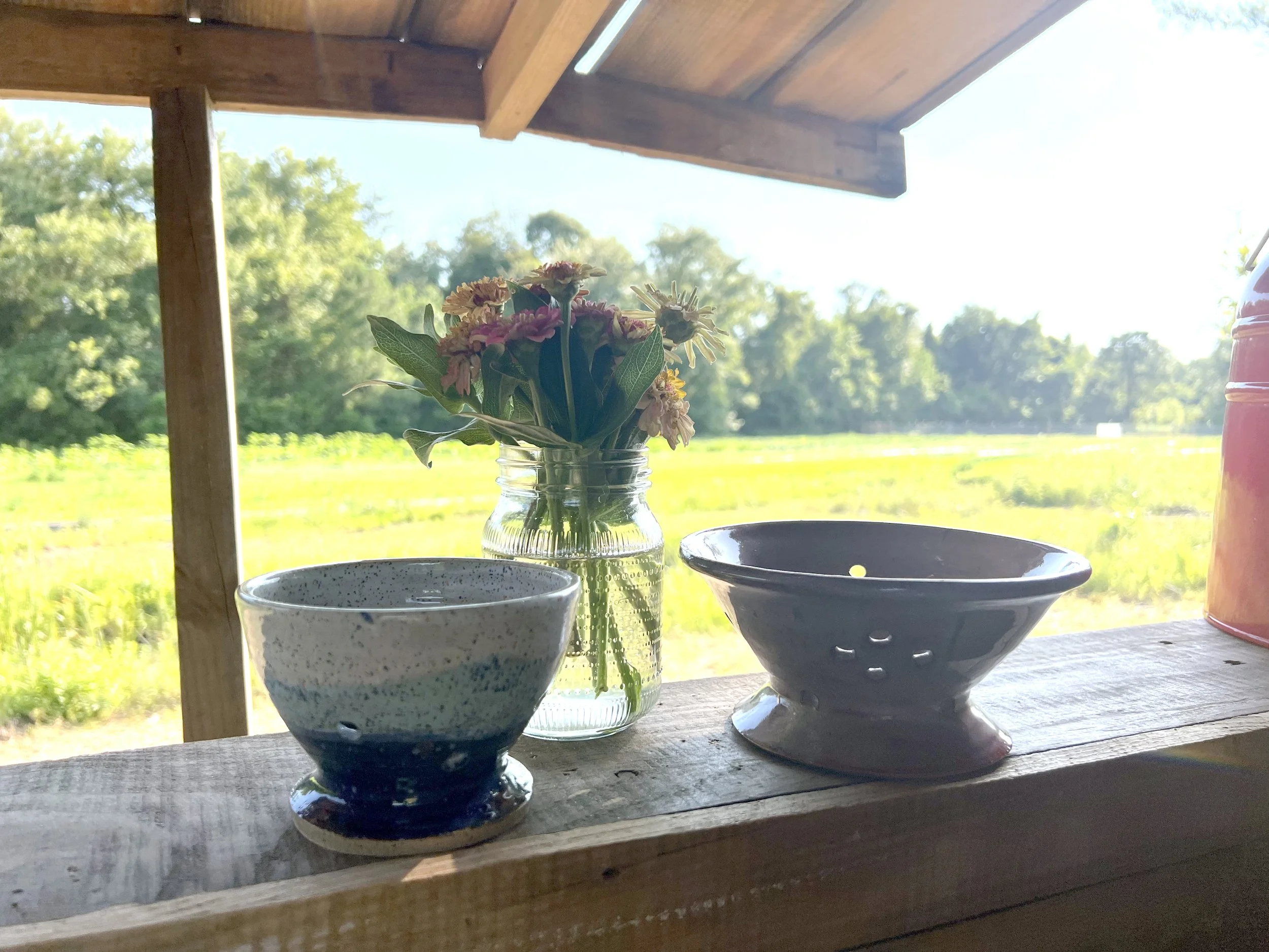 Clayvino pottery in windowsill at Bluebird Farm.jpg