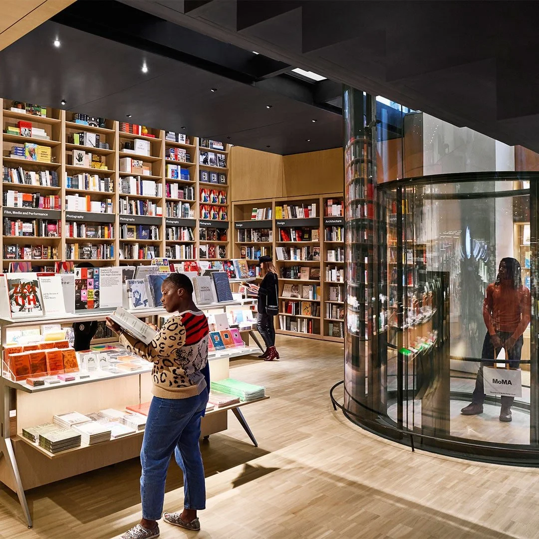 New MoMA Flagship Store Boasts a Two-Story Bookshelf with 2,000 Books (DESIGN MILK)