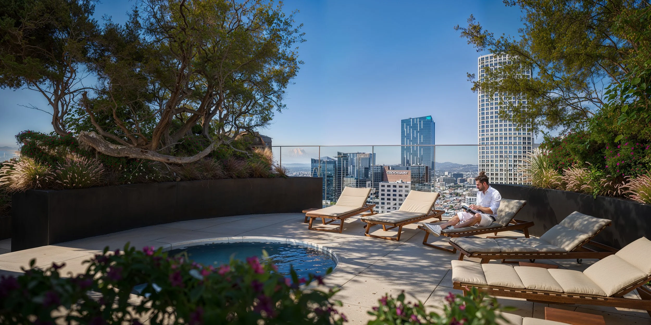 A rooftop with lounging chairs, a hot tub, plants, and a city skyline with tall buildings in the background. A man sits on one of the lounge chairs reading a book.