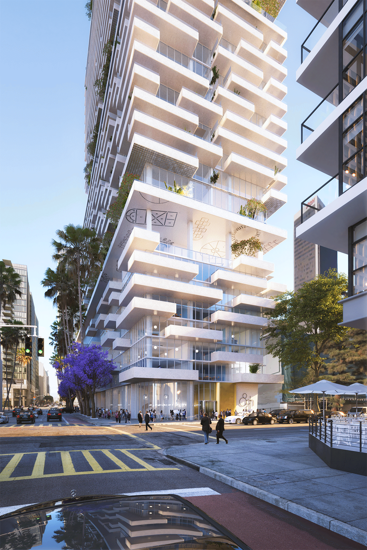 Modern multi-story residential building with white balconies and greenery, situated in an urban area with pedestrians, cars, and palm trees.