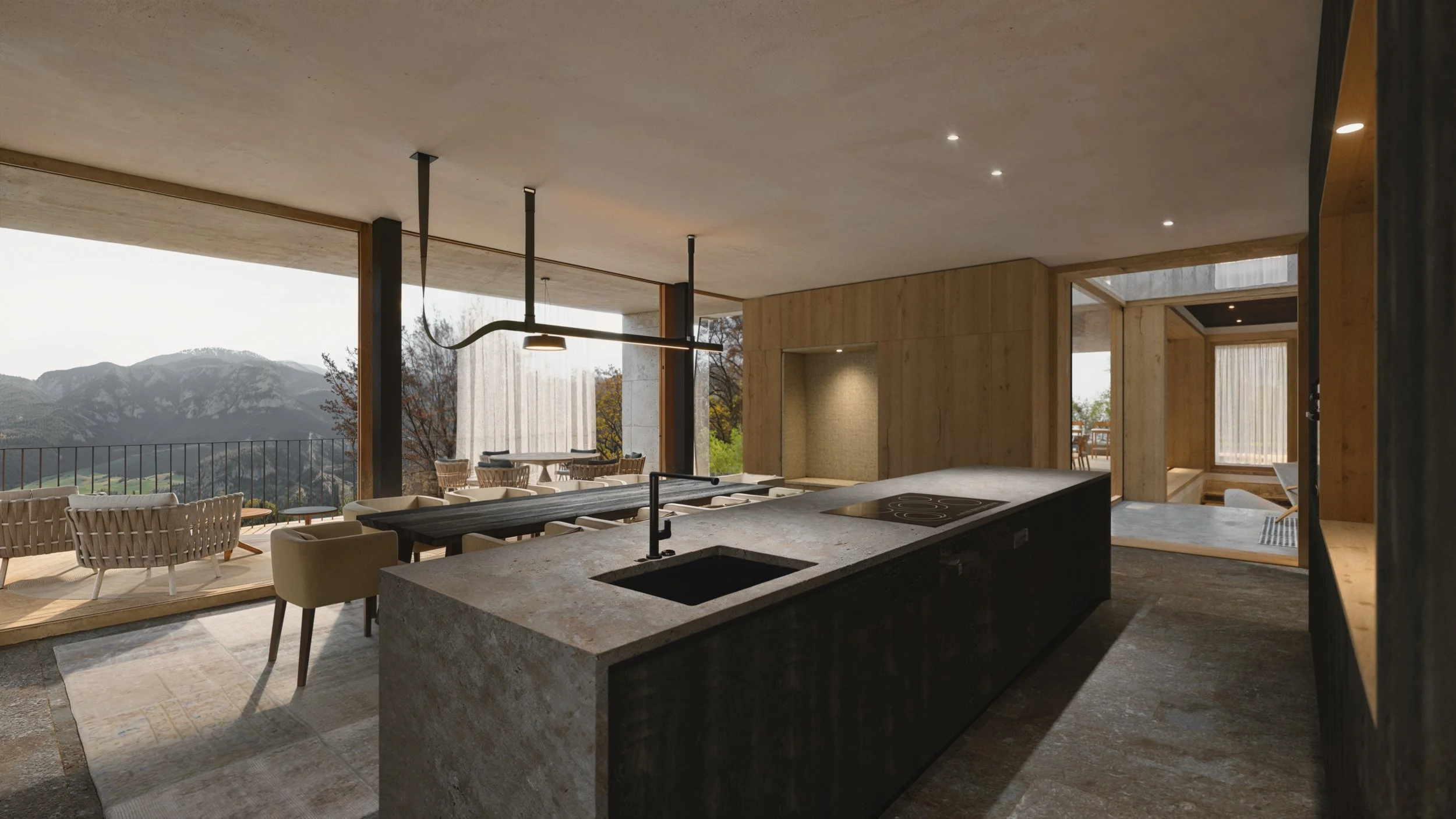 Open-concept kitchen and living space with large windows overlooking mountains, featuring a kitchen island with a sink, stove, and seating area, with indoor and outdoor seating areas.