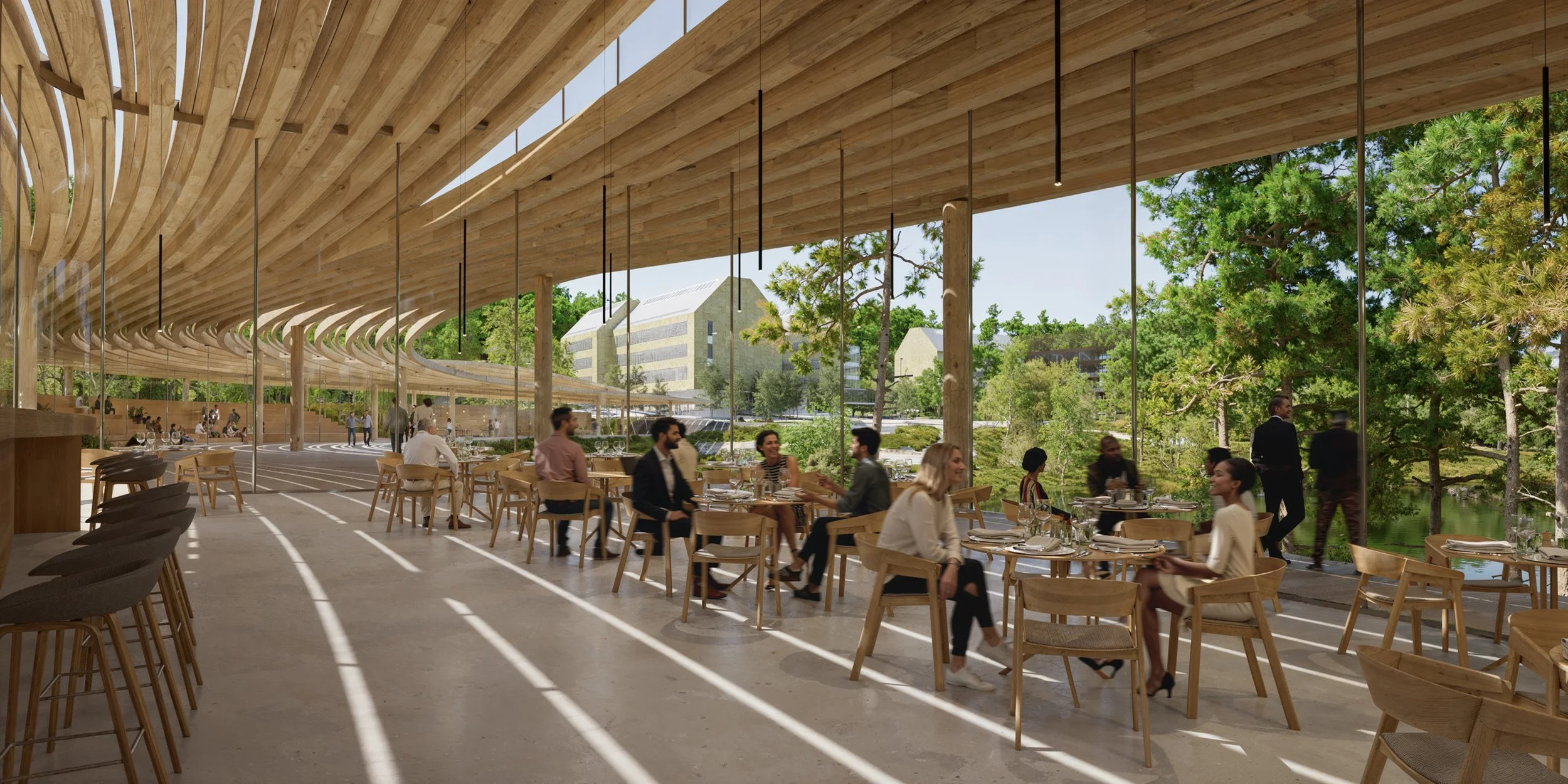 A modern restaurant with wooden architecture, large windows, and outdoor seating area. Several people are dining and socializing, with greenery and buildings visible outside.