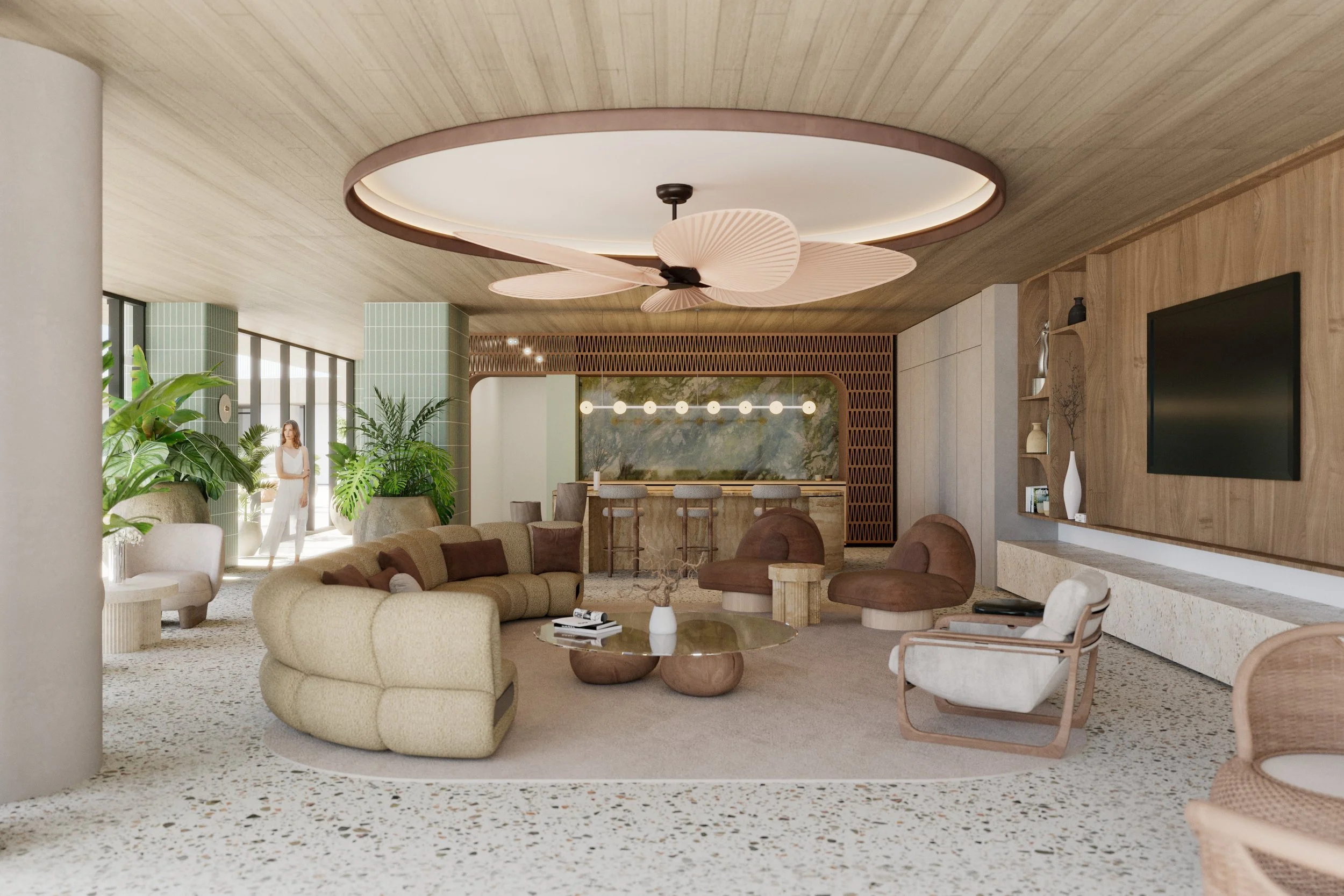 Modern hotel lobby with green potted plants, beige and brown furniture, a terrazzo floor, and a bar area in the background.