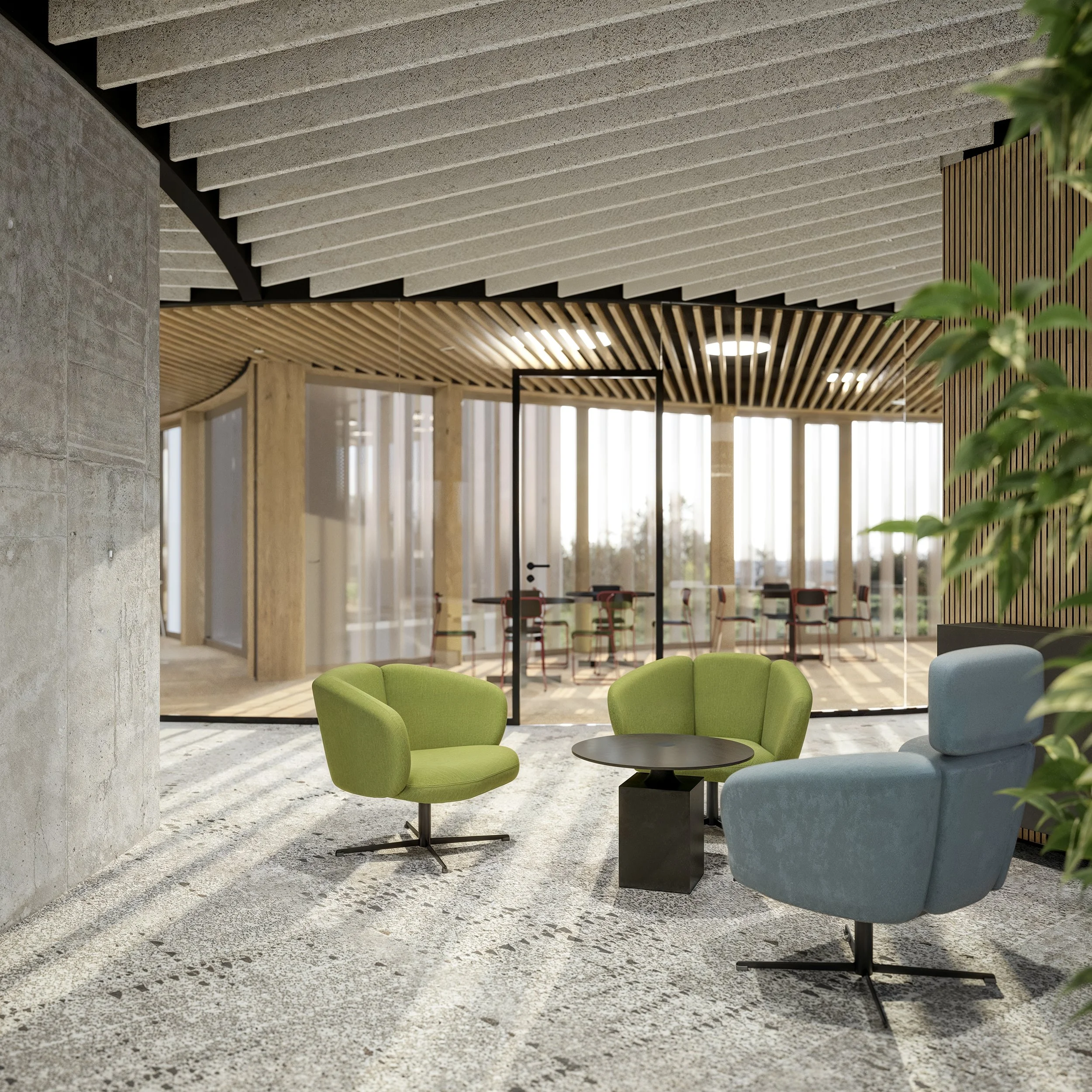 Modern office lounge with colorful chairs, a small black table, and glass-walled meeting room in the background.