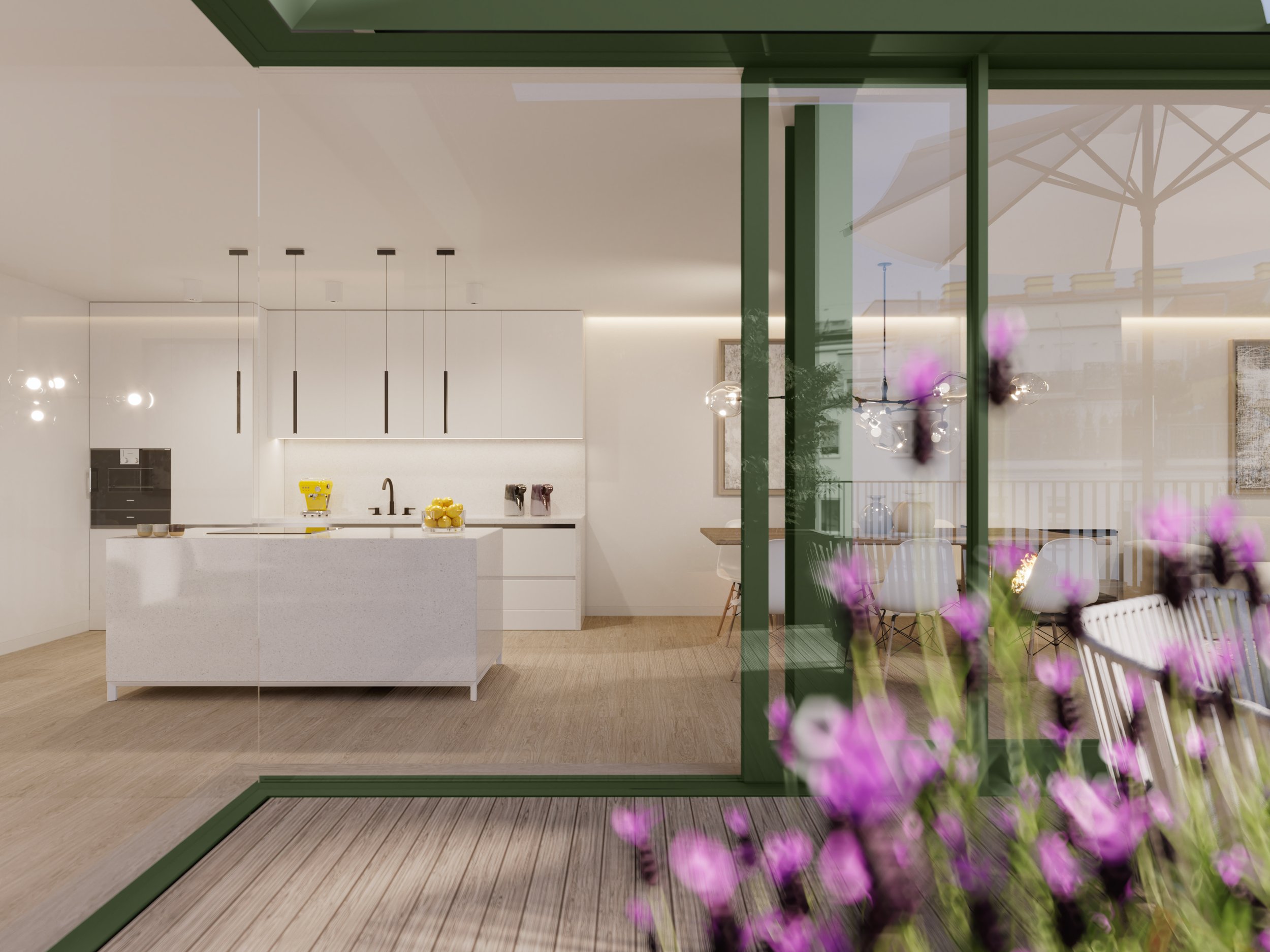 Modern kitchen with white cabinets and island, with a view into a dining area with chairs and tables outside on a patio with purple flowers in the foreground.