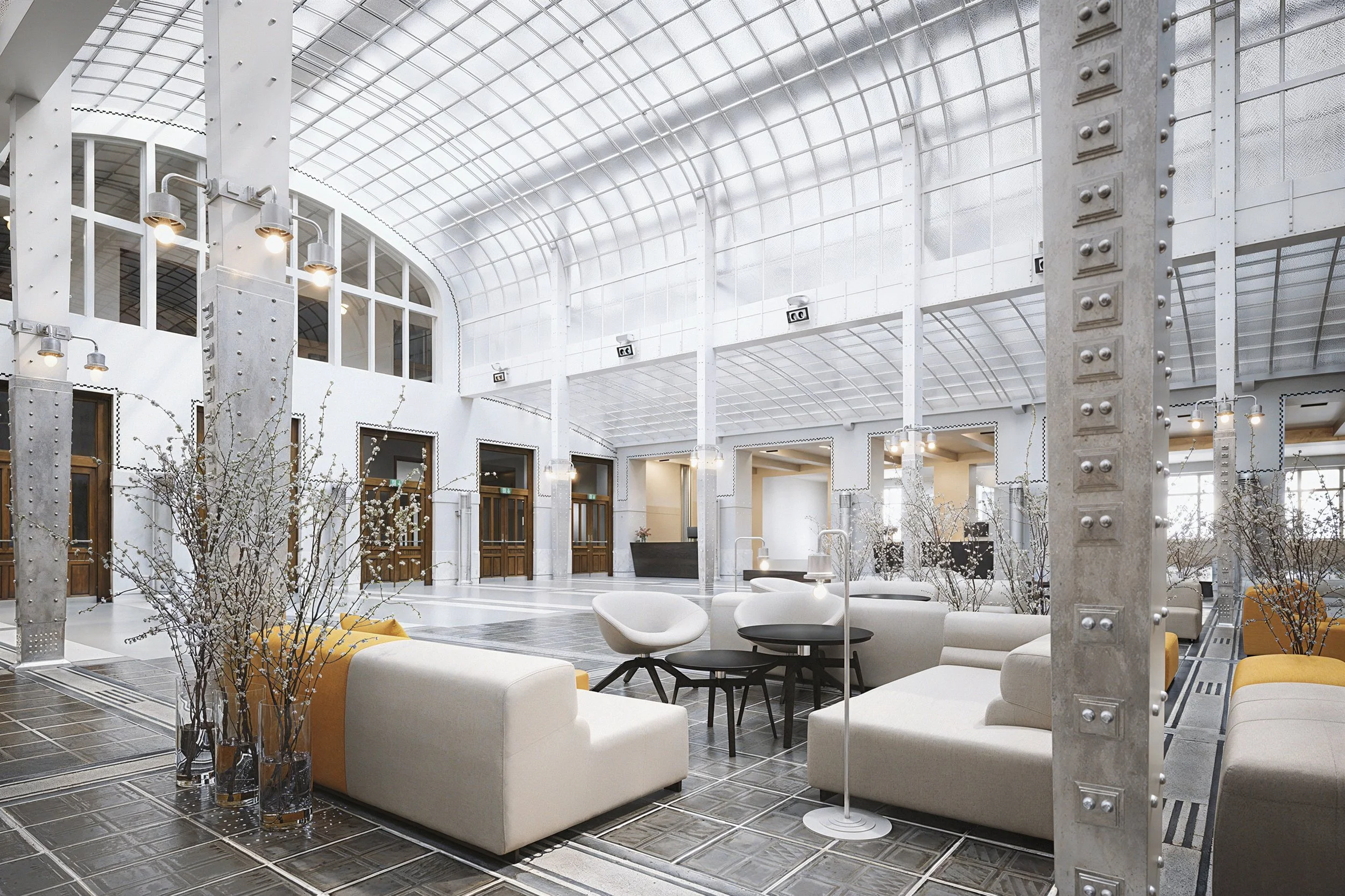 Modern indoor lounge area with white sofas, black coffee tables, and decorative branches in vases, set against a high arched glass ceiling and industrial metal columns.