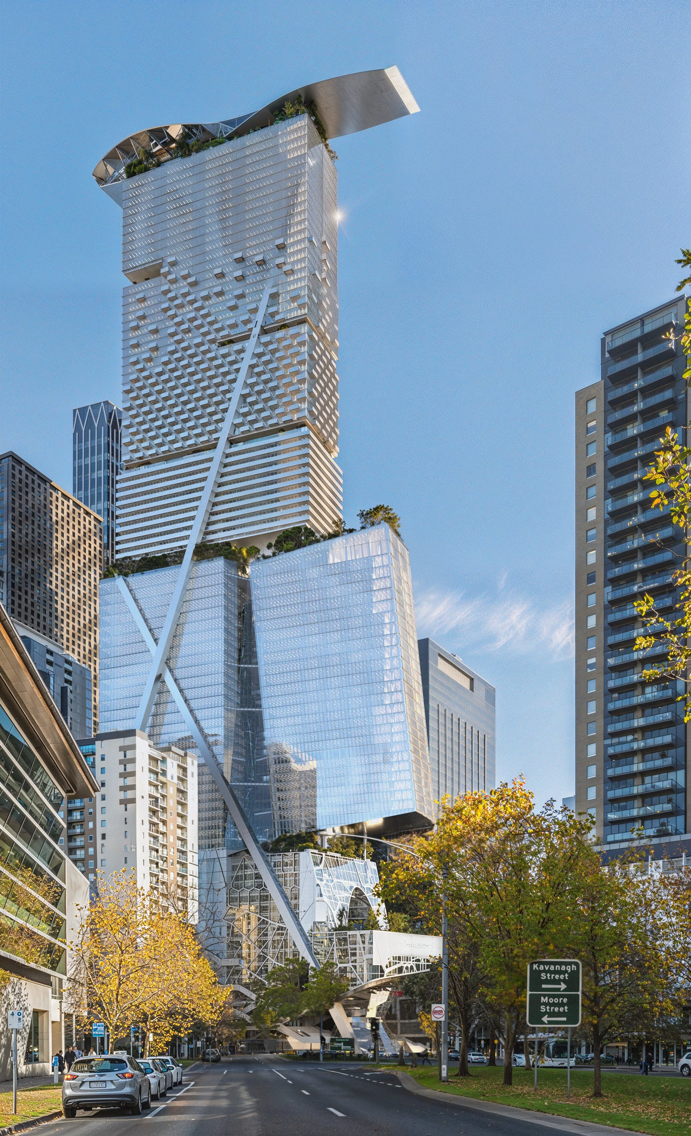 A modern, uniquely designed skyscraper with reflective glass exterior and angular structures, situated among other high-rise buildings, with trees and parked cars in the foreground on a sunny day.