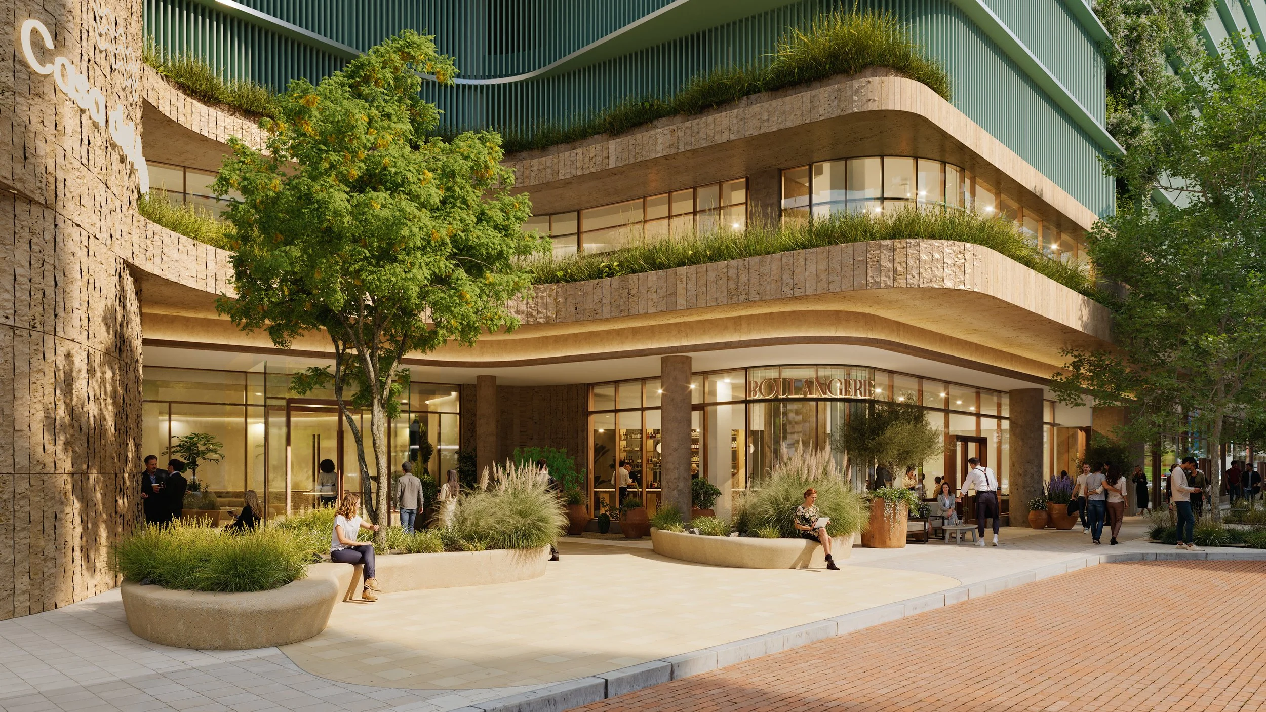 Modern multi-story building with curved architecture, glass windows, and outdoor seating areas with people walking, sitting, and socializing, surrounded by trees and plants.