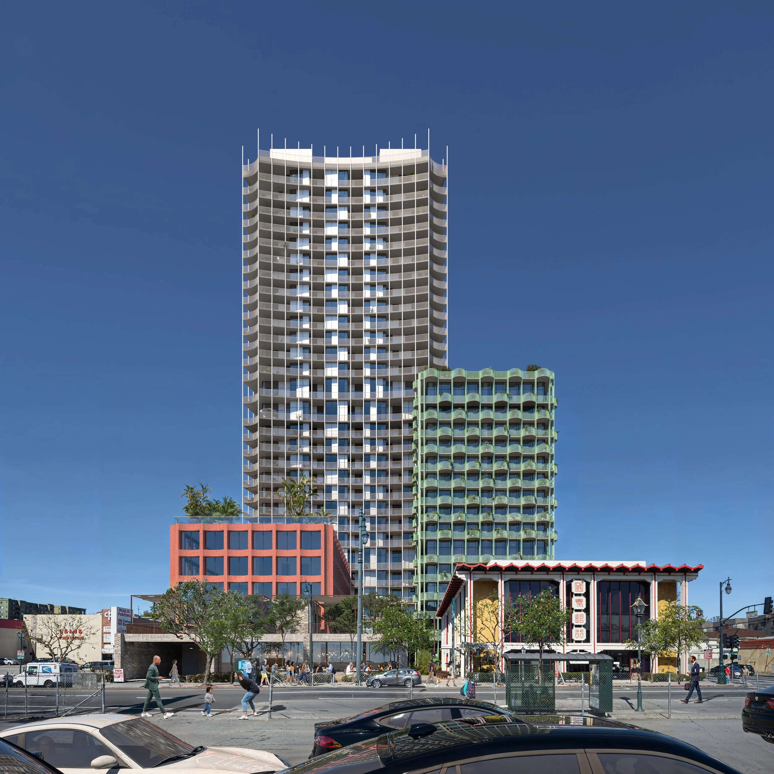 Cityscape with tall modern skyscrapers and lower buildings, pedestrians crossing the street, cars parked and moving, trees, and a clear blue sky.
