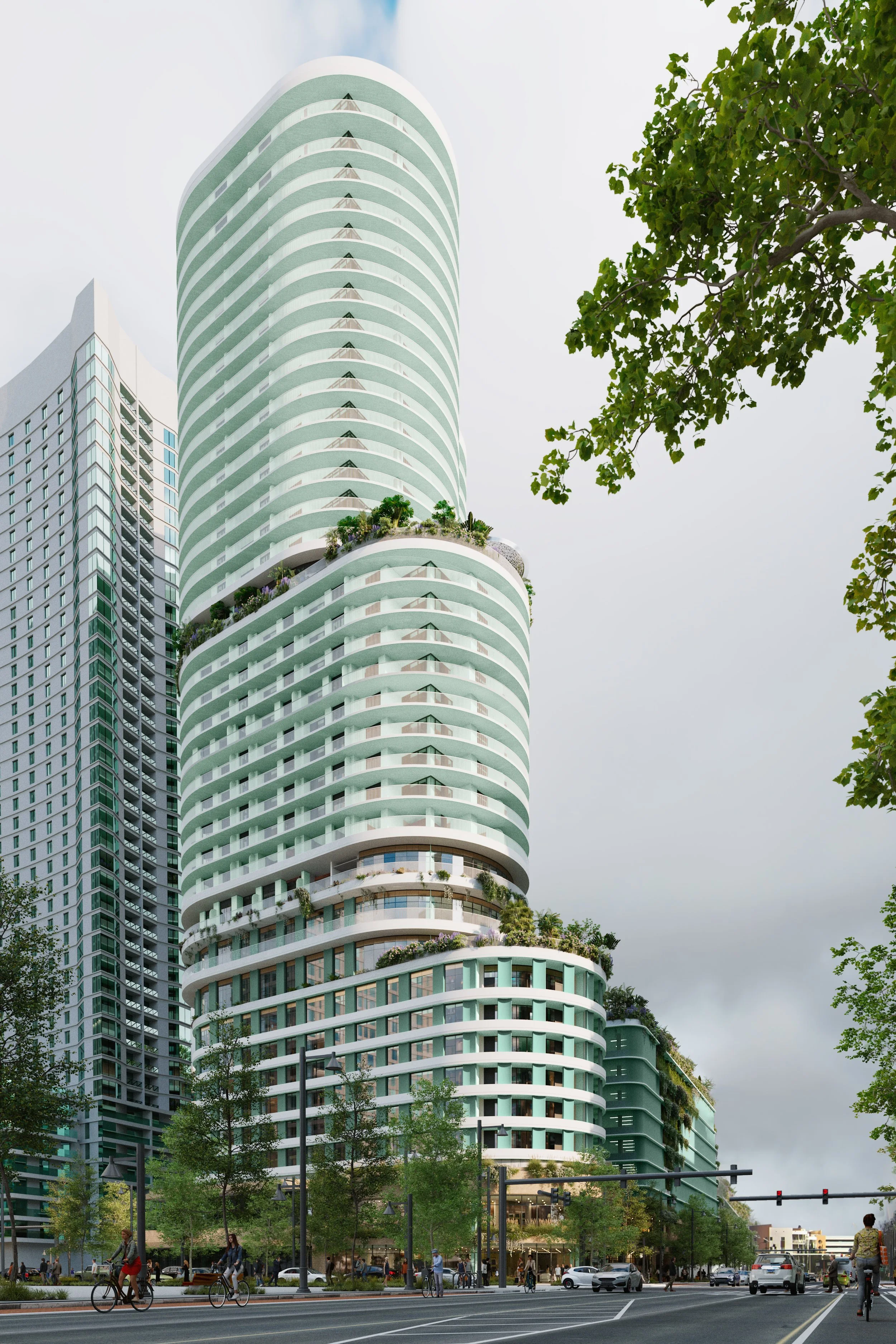 Modern high-rise building with curved balconies and greenery, surrounded by trees, traffic, and pedestrians on a city street.
