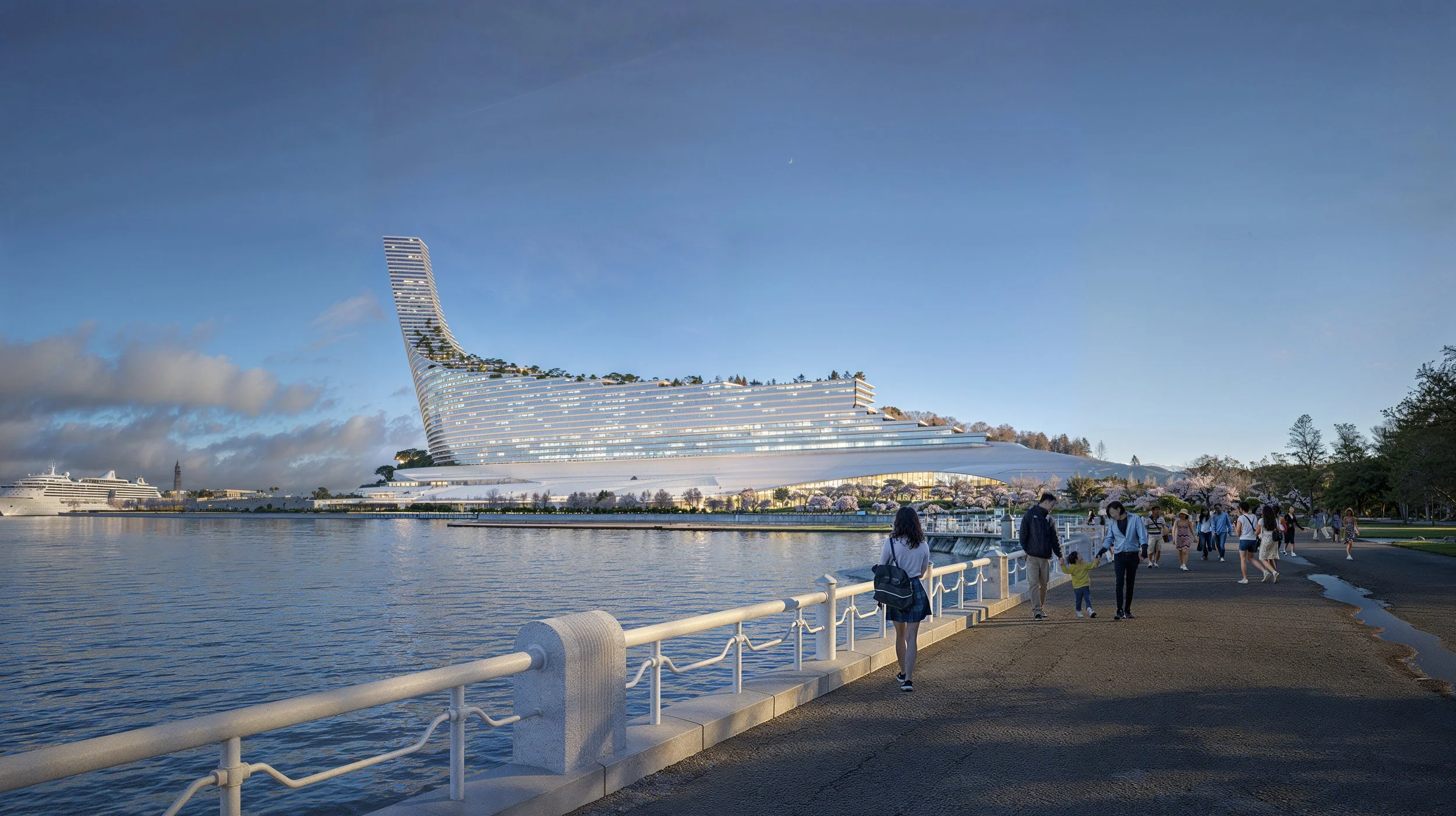 People walking along a waterfront promenade with a modern, uniquely shaped hotel building in the background, and a cruise ship in the water.