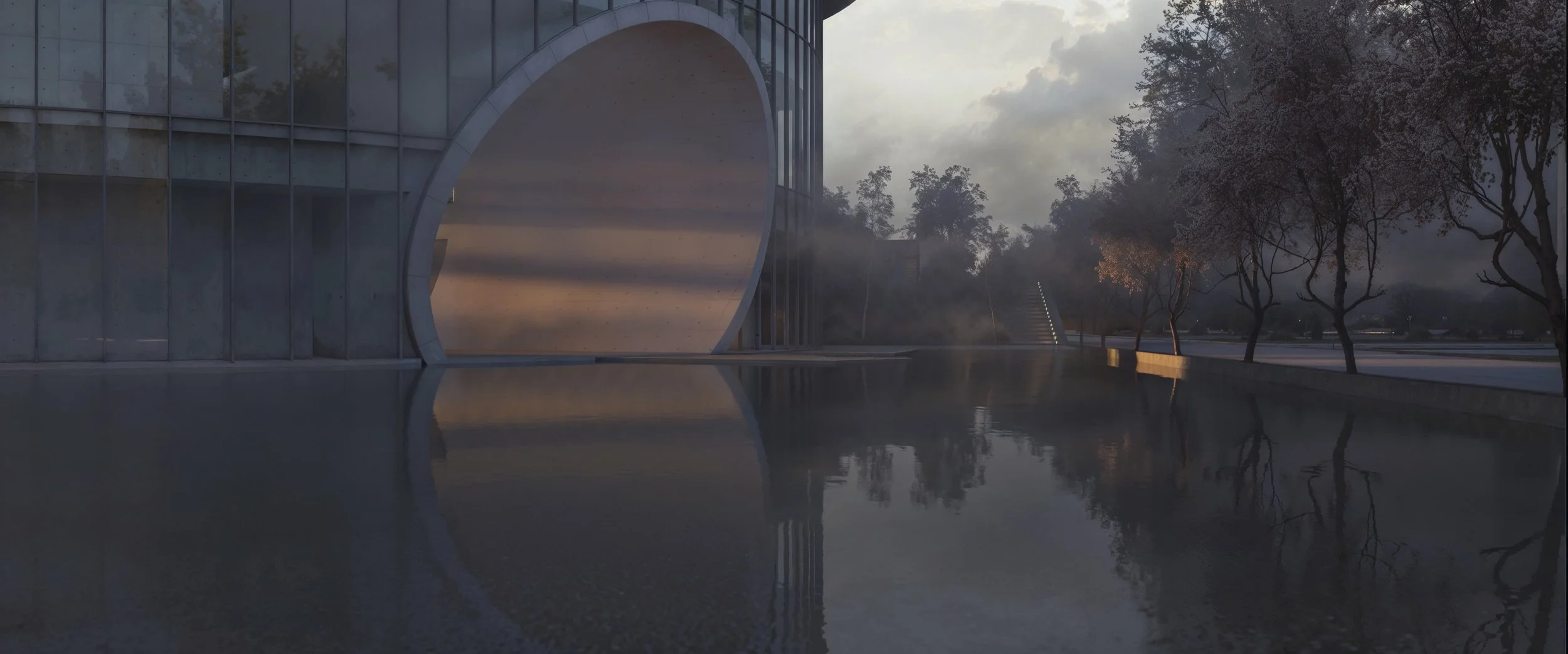 Modern building with large circular opening, reflecting in water, surrounded by trees at sunset or dawn.