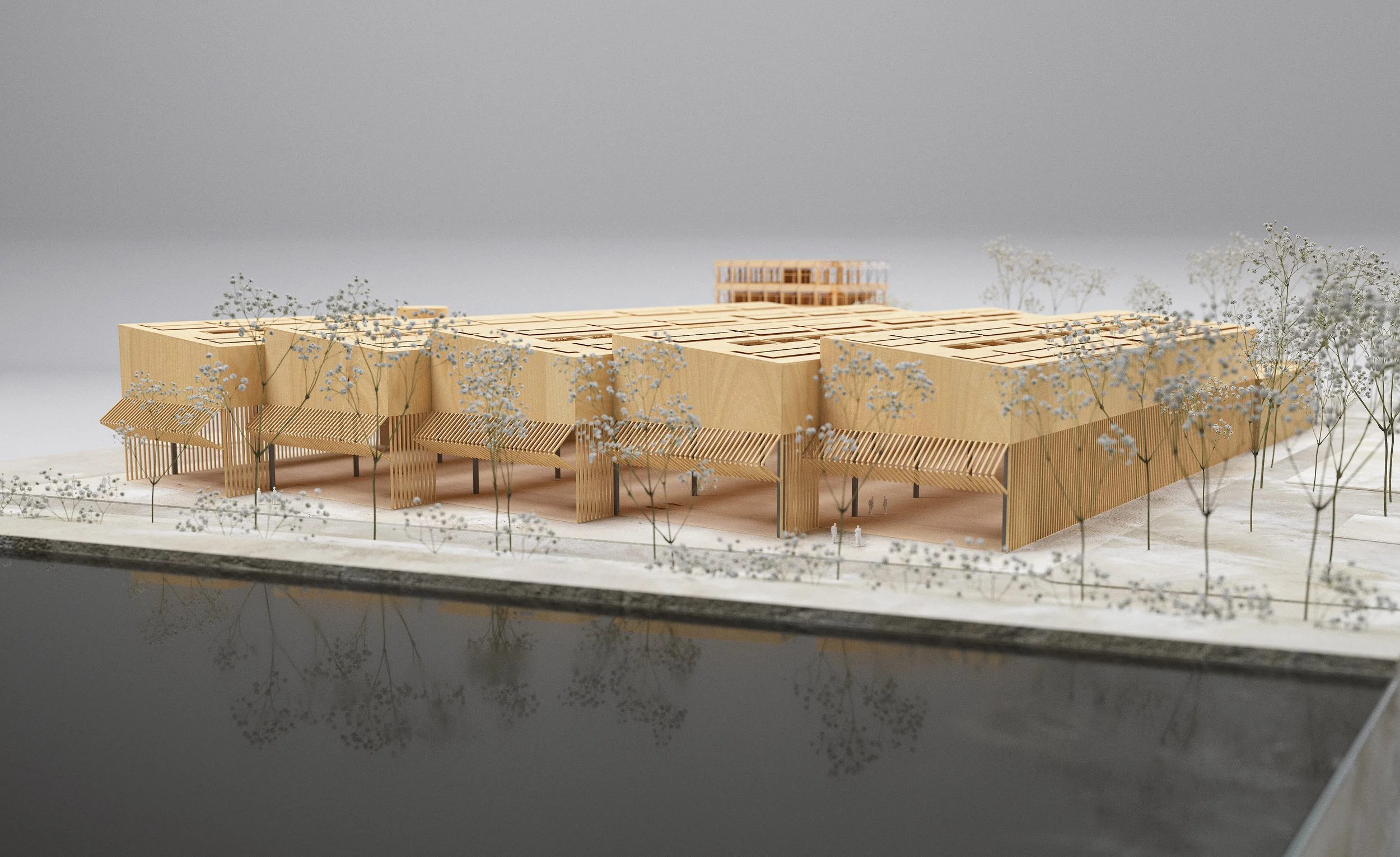A detailed architectural model of a modern building with surrounding trees and water reflection.