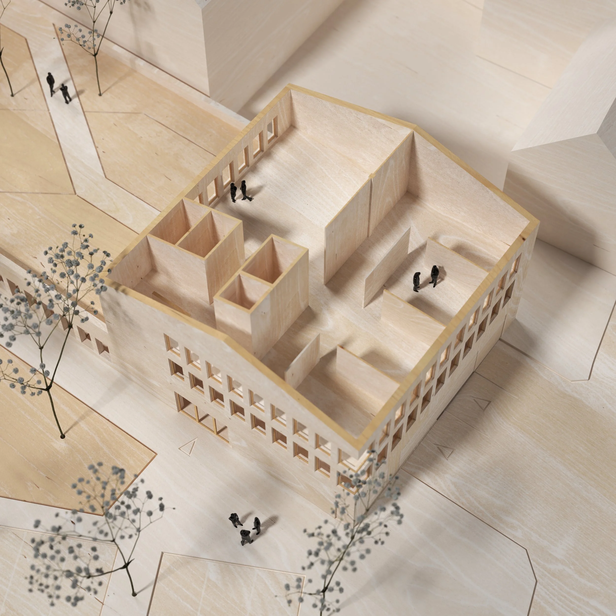 A scale model of a modern building with open interiors and small figurines representing people inside and outside, set on a wooden base with trees and pathways.