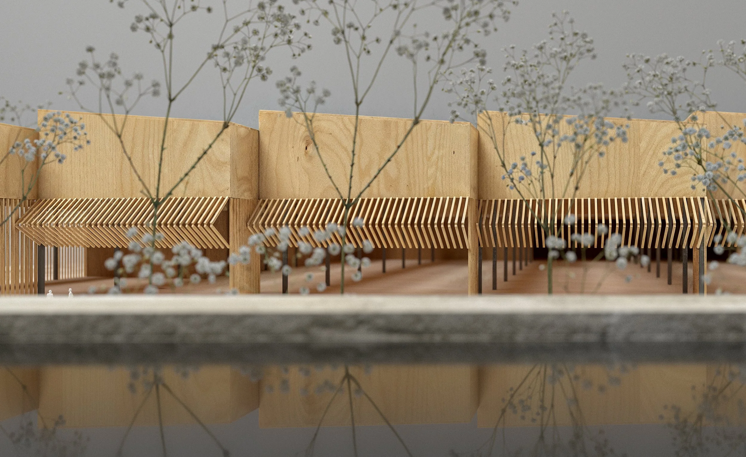 Architectural model with wooden slats, vertical supports, and sprigs of small white flowers in front.