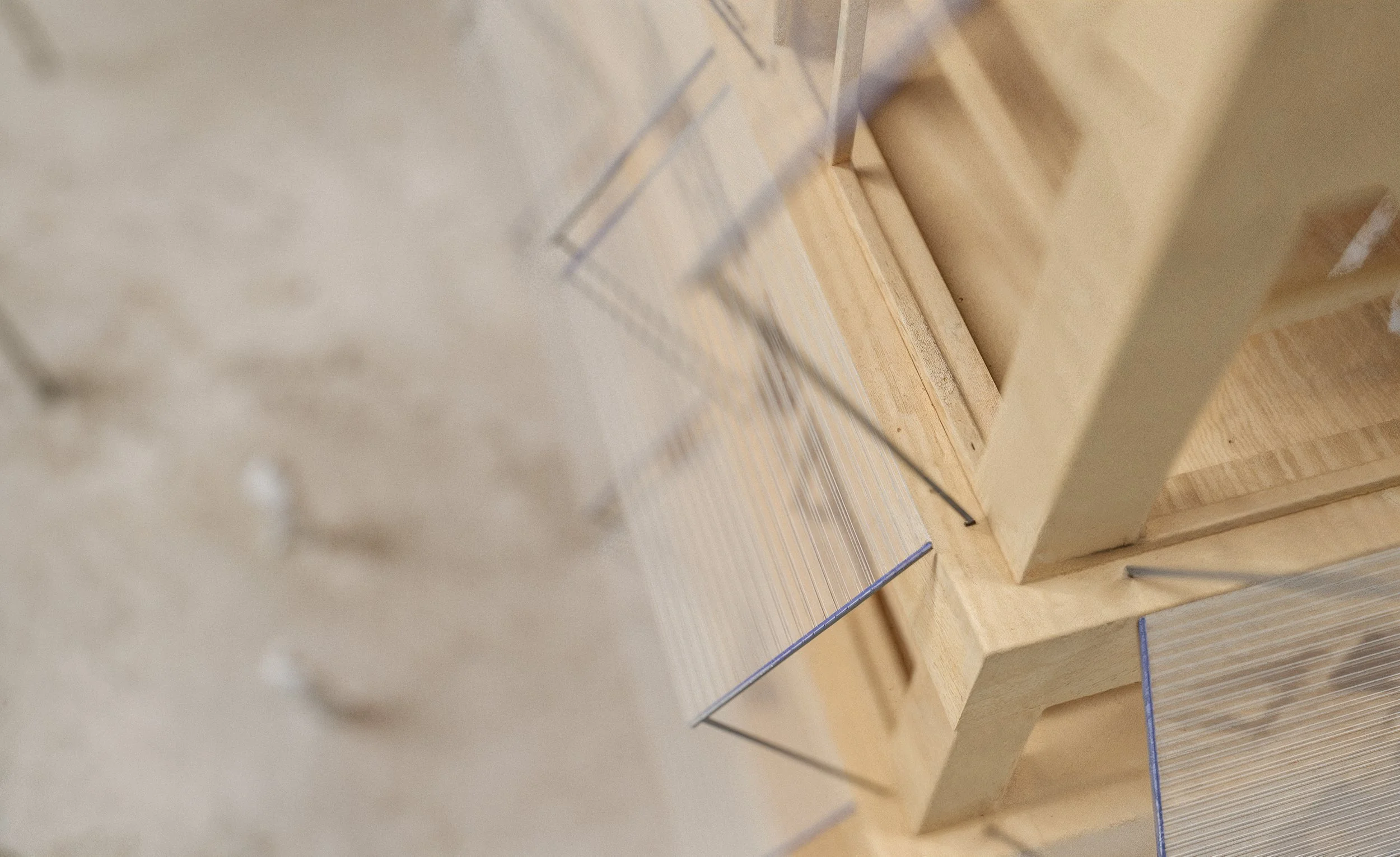 Close-up of wooden shelves in a store or warehouse with transparent acrylic dividers.