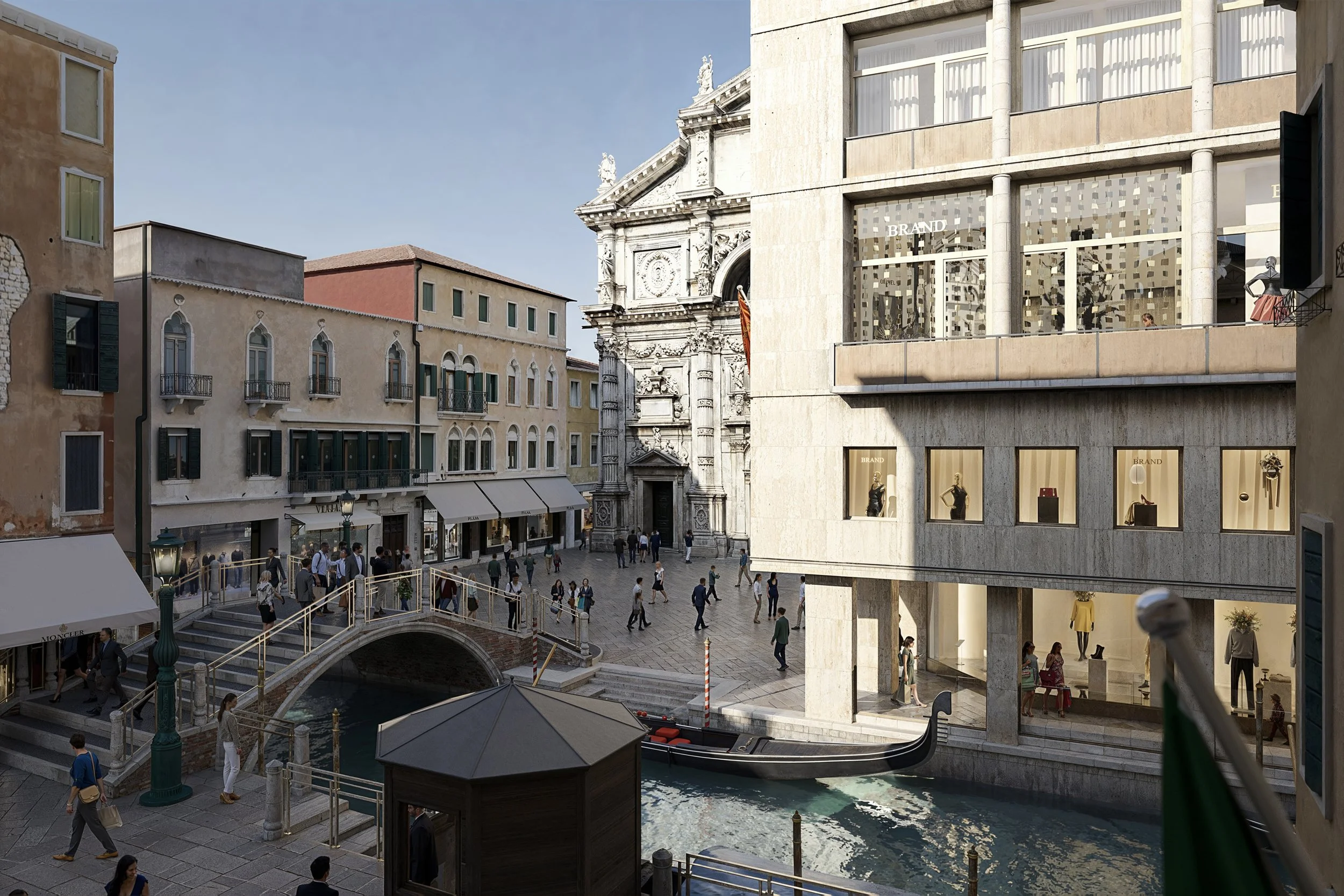 A bustling city square with shops, a small canal, and a bridge, surrounded by historic and modern buildings, with people walking and a gondola on the water.