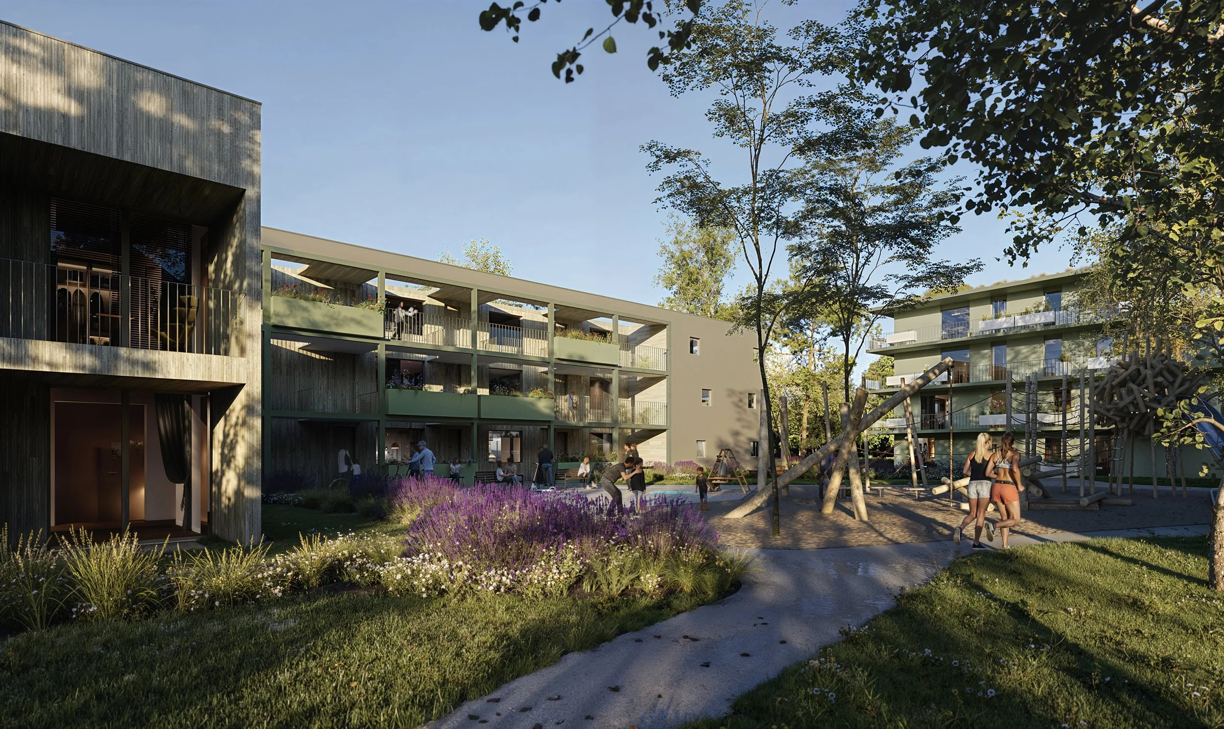 Modern residential complex with landscaped garden and playground, people walking and playing outside on a sunny day.