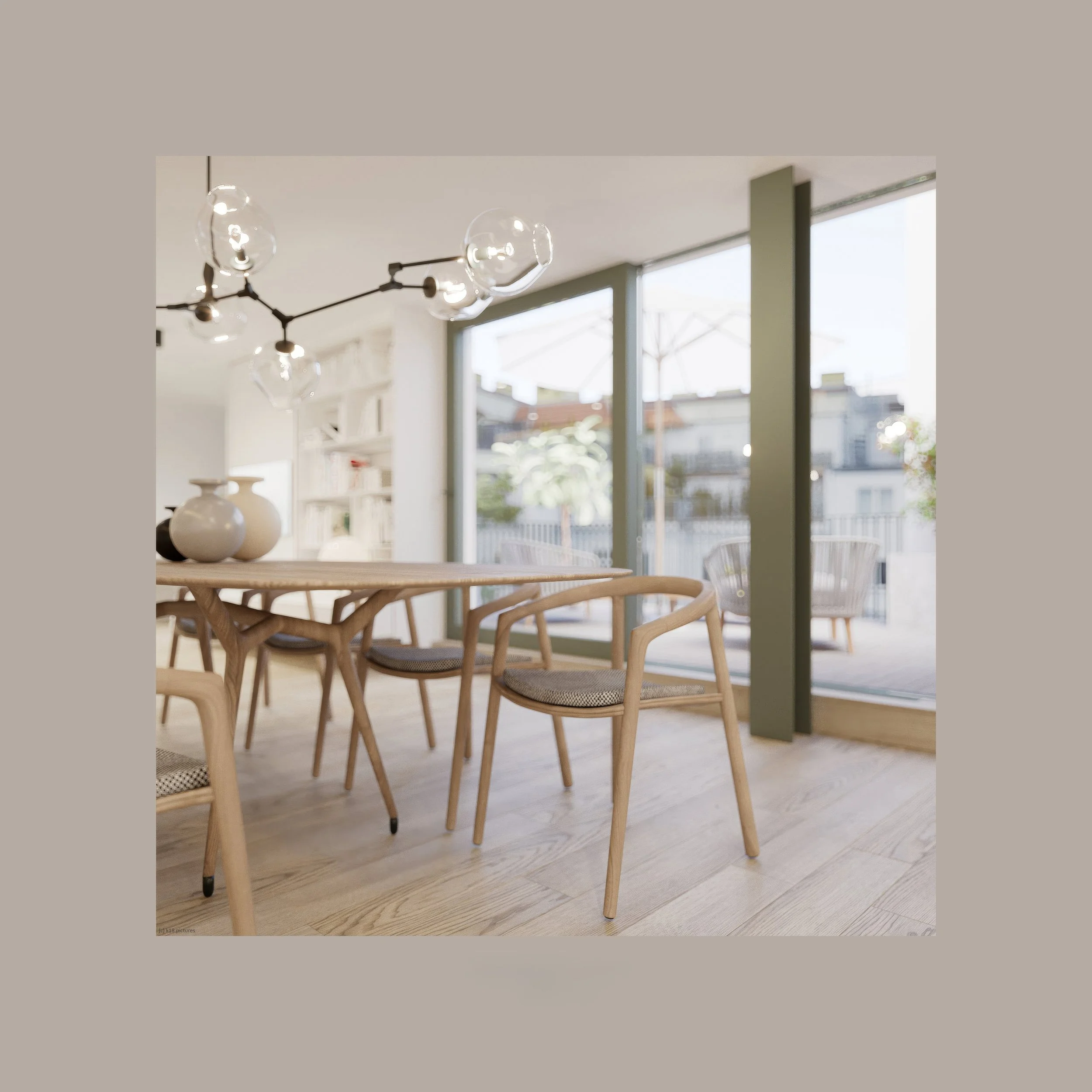 Modern dining room with wooden chairs, a wooden table, decorative vases, large windows with outdoor patio furniture, and a contemporary light fixture.
