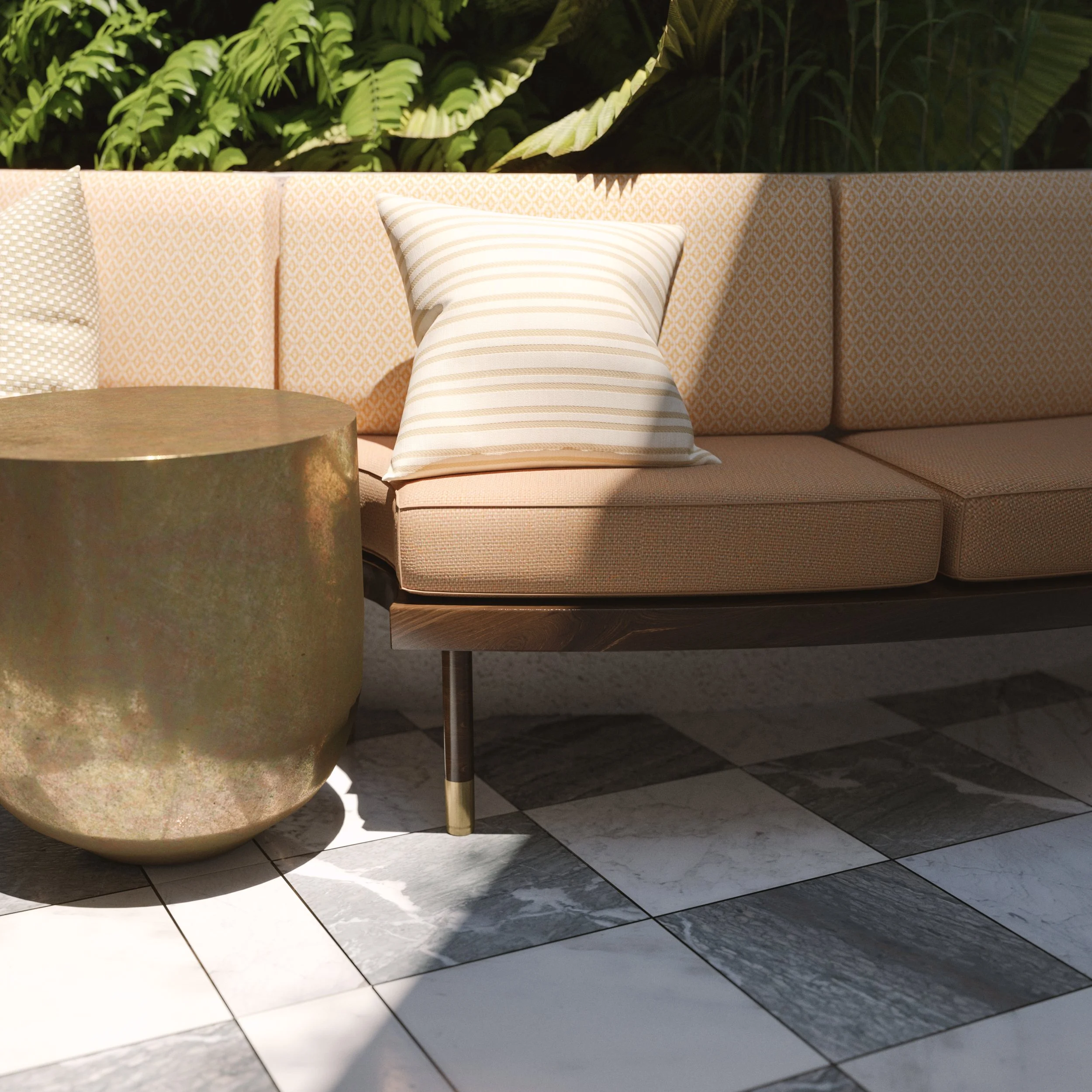 A beige sofa with patterned cushions and a striped pillow, next to a gold side table, with green plants in the background and a tiled floor.