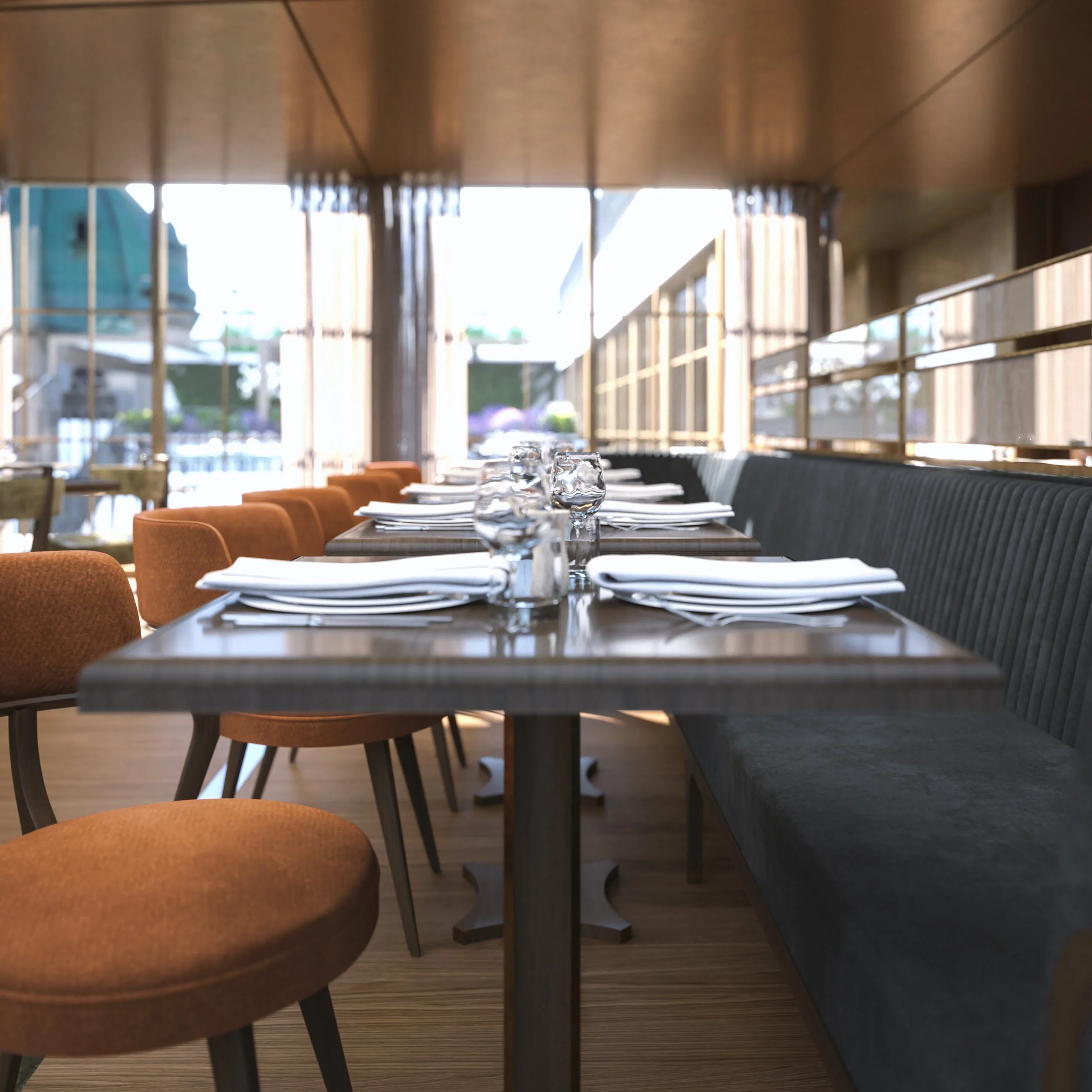 Empty restaurant table set with white napkins, clear drinking glasses, and plates in a contemporary dining area with large windows, orange chairs, and a black banquette.